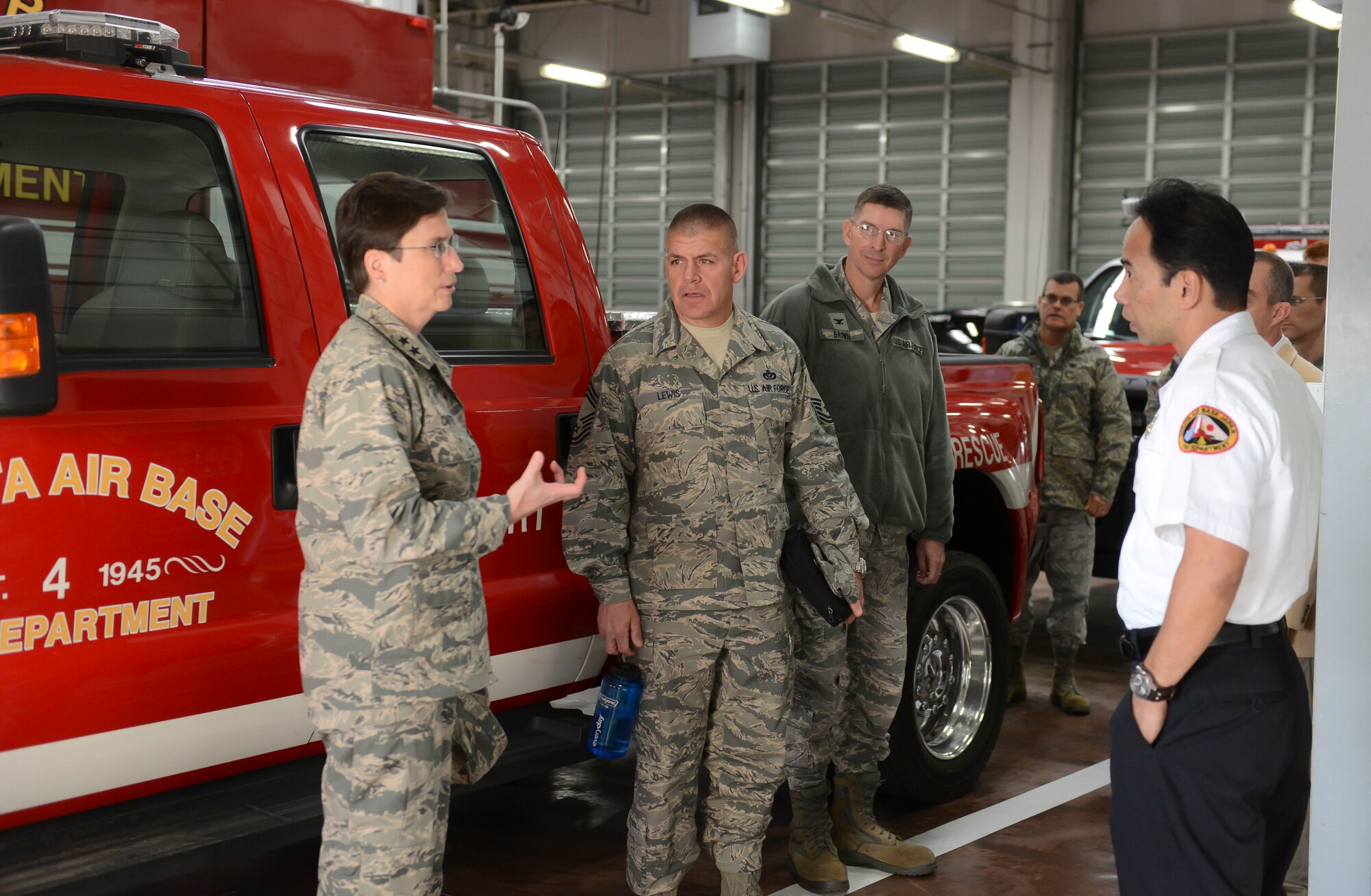 Maj. Gen. Theresa Carter, Air Force Civil Engineer, Deputy of Staff For Logistics, Installations and Mission Support, talks with Fire Chief Reynold Mateo at Yokota Air Base, Japan, Jan.23, 2014. Carter was given a mission brief and tour around the fire station as part of her visit at Yokota. (U.S. Air Force photo by Airman 1st Class Meagan Schutter/Released)