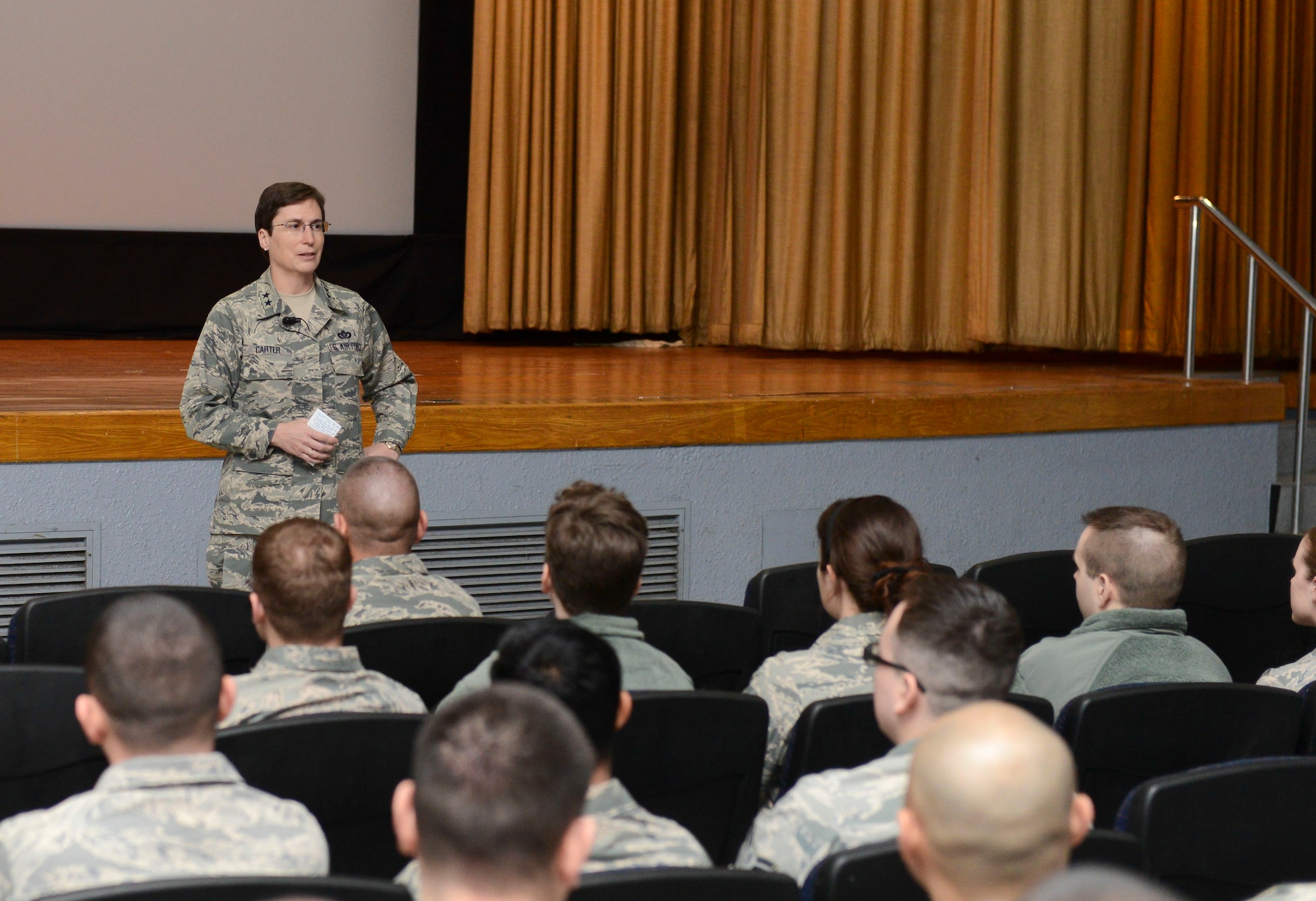 Maj. Gen. Theresa Carter, Air Force Civil Engineer, Deputy of Staff For Logistics, Installations and Mission Support, speaks with Airmen from the 374th Civil Engineer Squadron in the base theater at Yokota Air Base, Japan, Jan.23, 2014. Carter thanked the Airmen for their service and discussed the upcoming challenges of the Air Force. (U.S. Air Force photo by Airman 1st Class Meagan Schutter/Released)