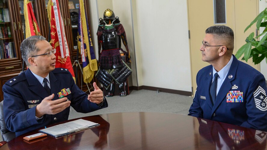 Chief Master Sgt. Manuel Roblesreynoso, 374th Airlift Wing command chief, meets with Japan Air Self-Defense Forces Maj. Gen. Koichi Nishitani, 4th Air Depot commander, Jan. 30, 2014, at Iruma Air Base, Japan.  Chief Roblesreynoso was invited by Iruma Air Base leadership to observe their Tech. Sgt. training.  (U.S. Air Force photo by Airman 1st Class Soo C. Kim / released)