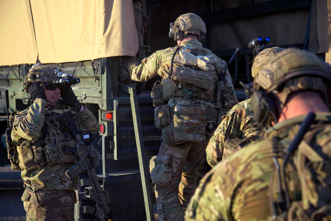 Army Rangers board an M1078 Light Medium Tactical Vehicle during Task Force training on Fort Hunter Liggett, Calif., Jan. 26, 2014. They are assigned to Company A, 2nd Battalion, 75th Ranger Regiment. Rangers train continuously to maintain the highest level of tactical proficiency.