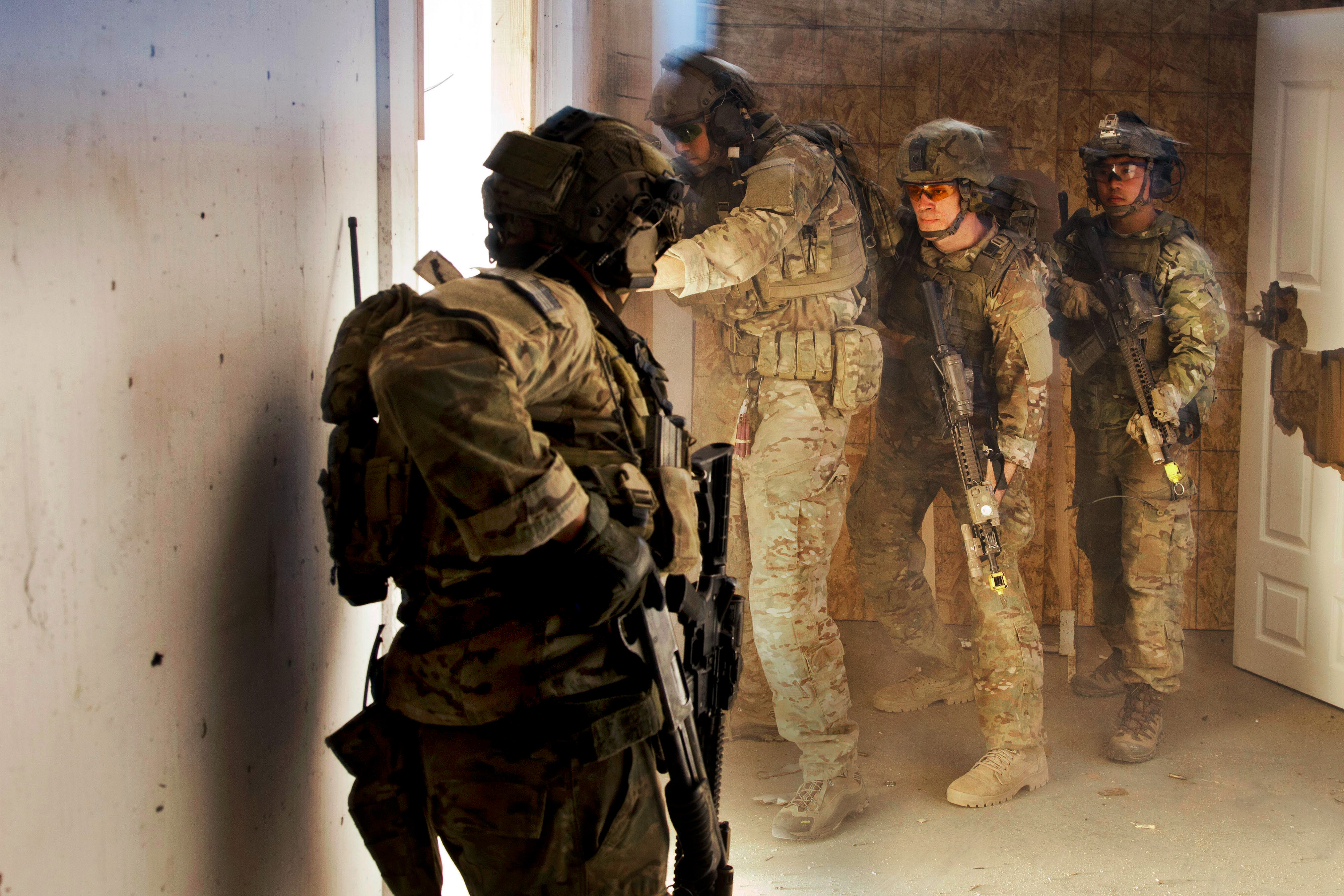 Army Rangers clear rooms inside a shoot house facility during Task