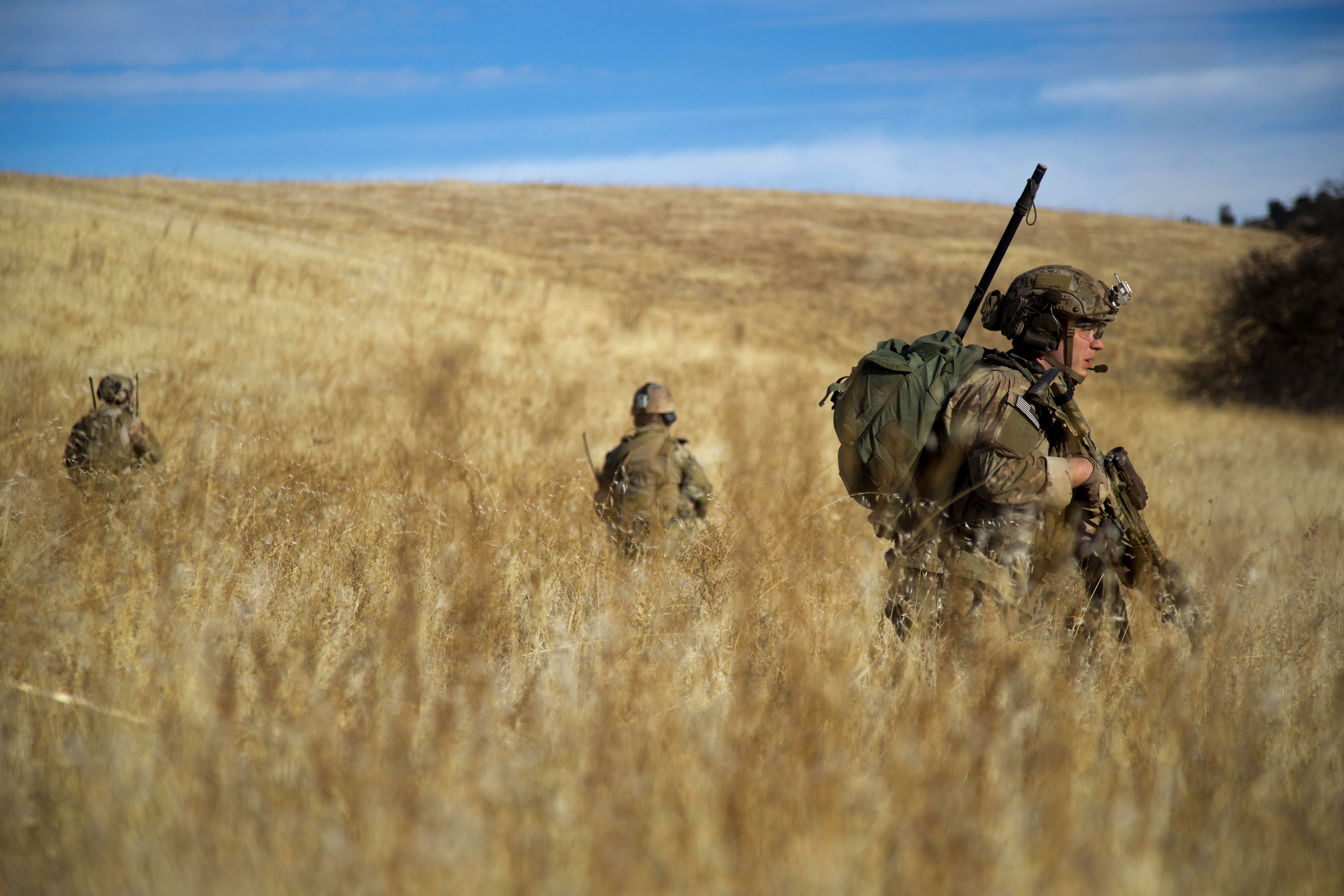 Army Rangers patrol toward a rally point after completing an exercise