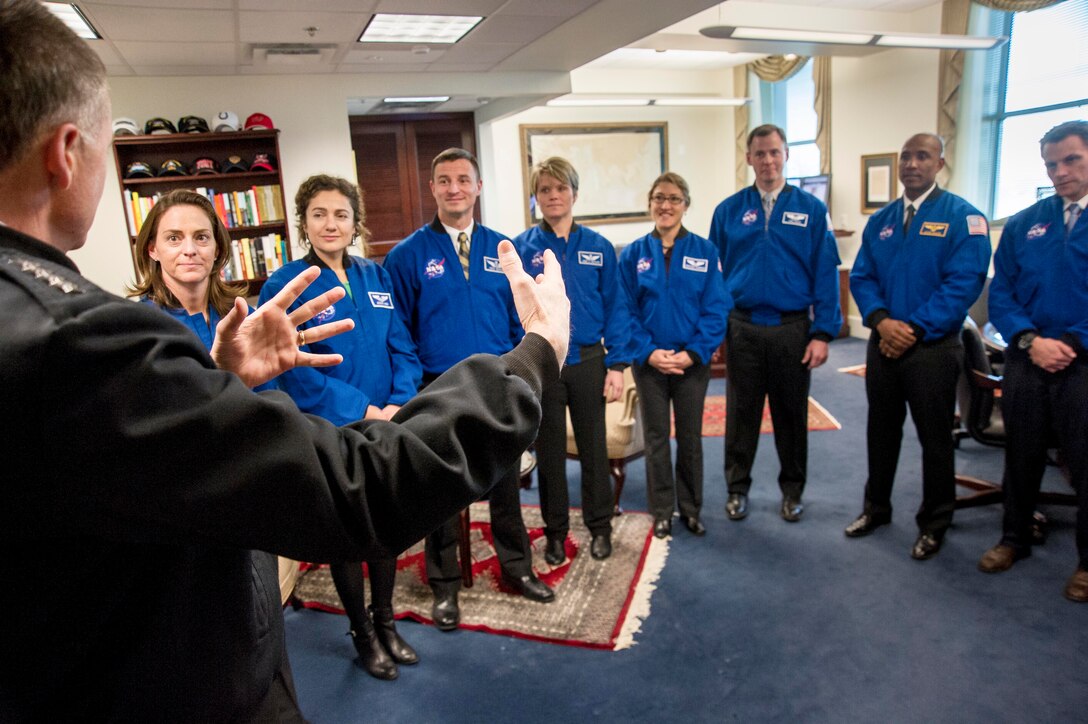 Navy Adm. James Winnefeld, vice chairman of the Joint Chiefs of Staff, speaks with NASA’s newest astronauts in his office at the Pentagon, Jan. 31, 2014. Left to right: Marine Maj. Nicole Mann, Dr. Jessica Meir, Army Dr. (Maj.) Andrew Morgan, Army Maj. Anne McClain, Dr. Christina Hammock, Air Force Lt. Col. Nick Hague, Navy Lt. Cmdr. Victor Glover and Navy Lt. Cmdr.  Josh Cassada. DOD photo by U.S. Army Staff Sgt. Sean K. Harp