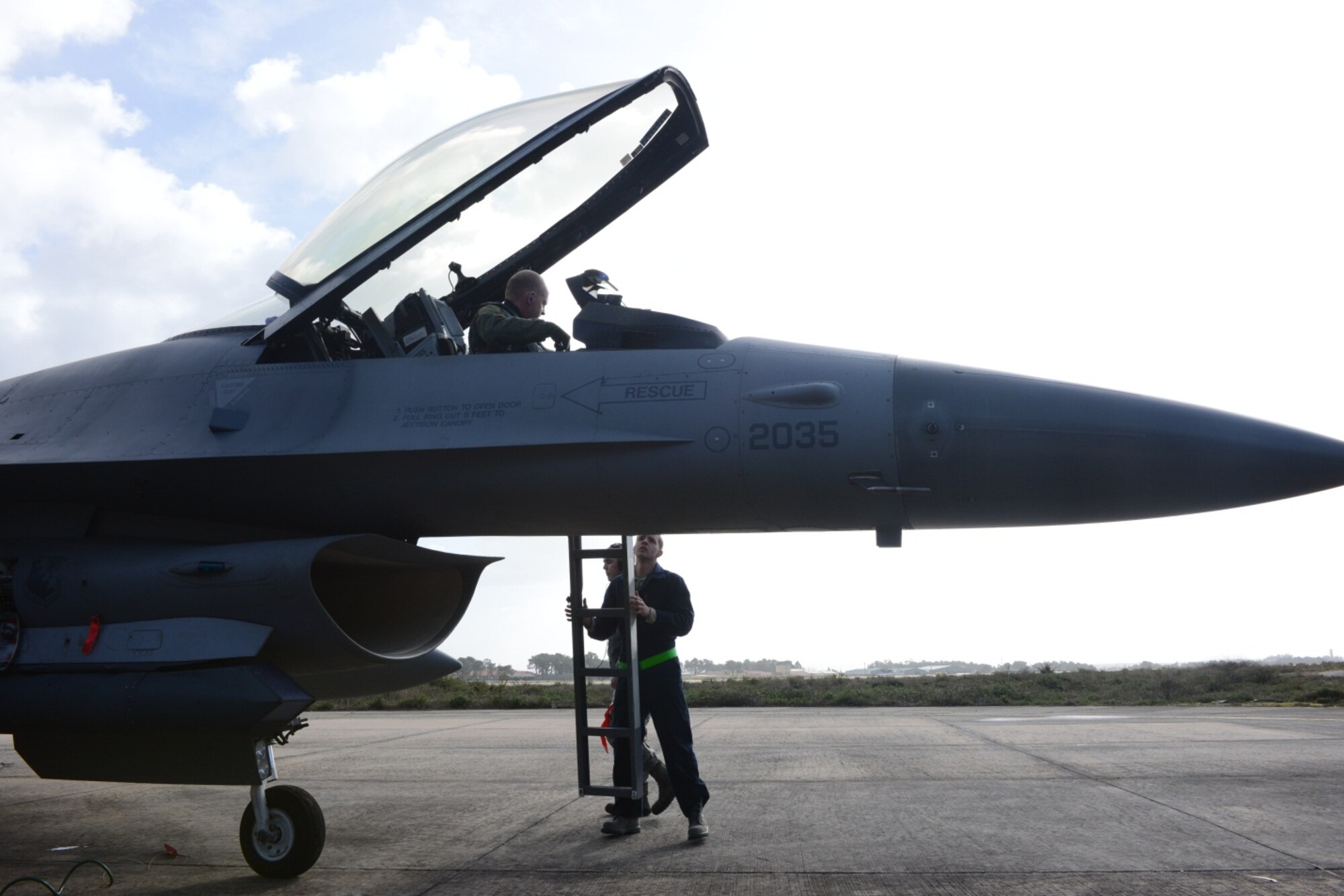 Two maintainers assist a pilot from the 555th Fighter Squadron after a morning flight Feb. 3 in Monte Real Air Base, Portgual. Approximately 260 personnel from the 31st Fighter Wing arrived in Monte Real Air Base, Portugal, in support of REAL THAW 14--a two-week close air support exercise hosted by the Portuguese Air Force. (U.S. Air Force photo/2nd Lt. Allie Delury)
 