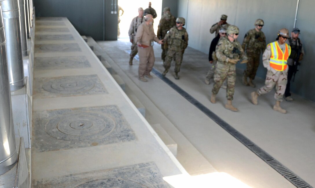 U.S. Army Corps of Engineers, Transatlantic Division Commander Maj. Gen. Michael Eyre and Corps officials walk past wood burning cooking stoves in anAfgan National Army dining facility at a newly-built  installation which according to Maj. Gen. Michael Eyre is some of the best construction he’s seen in Afghanistan. The Afghan National Army's 215th Combat Logistics Brigade will soon call these Camp Shorabak facilities home. (U.S. Army Corps of Engineers photo by Bill Dowell/released)