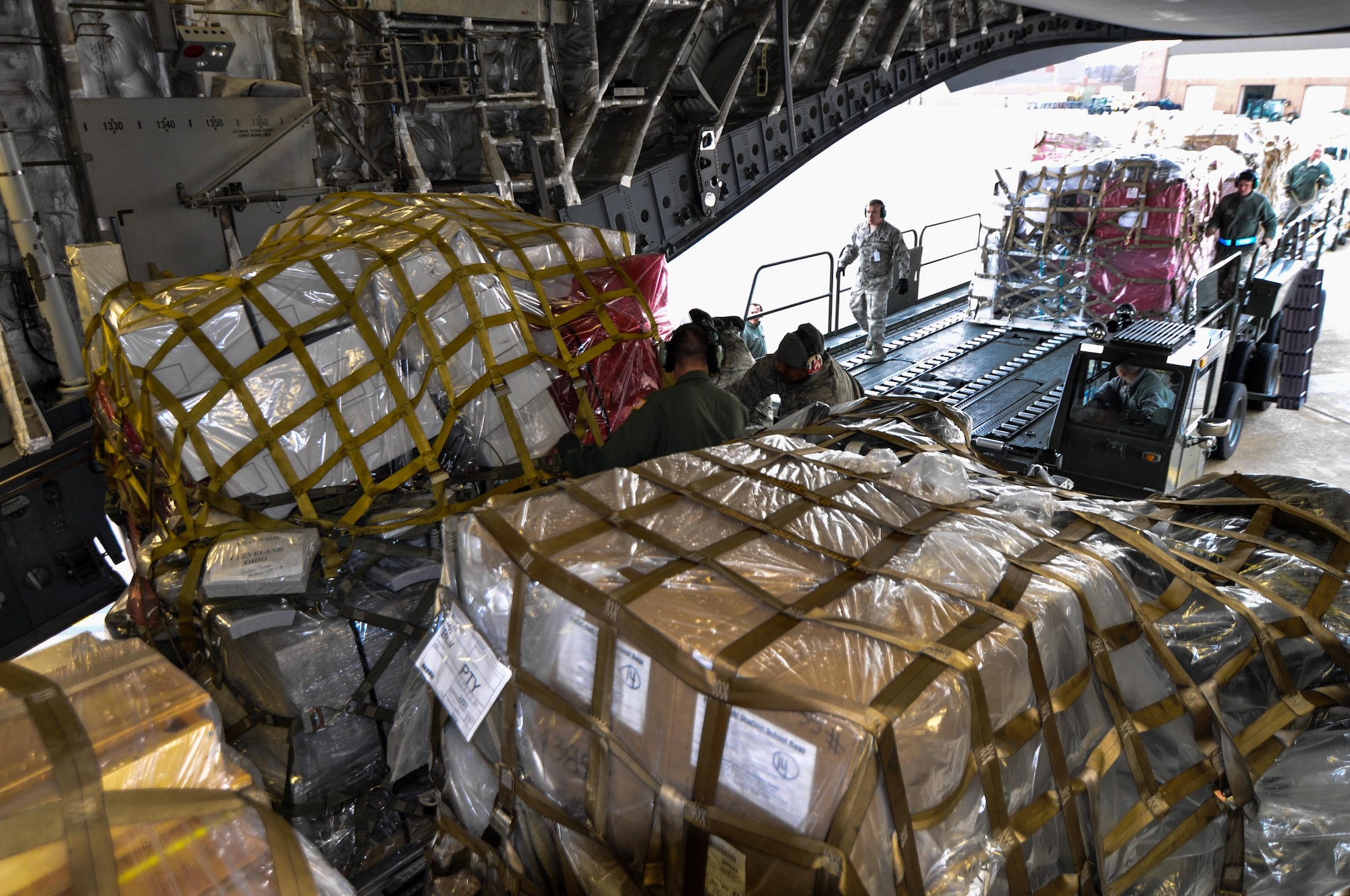 Reservists from the 701st Airlift Squadron load humanitarian aid onto a C-17 Globemaster III at Joint Base Charleston, S.C. The donated aid was delivered to Haiti, Panama and Honduras. (U.S. Air Force Photo/Maj. Wayne Capps)
 