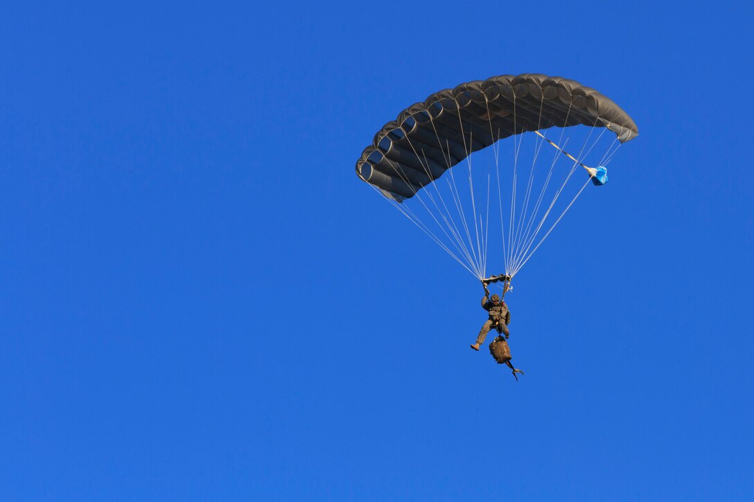 A U.S. Marine Corps force reconnaissance Marine with the 22nd Marine Expeditionary Unit (MEU) performs a free-fall jump out of an MV-22 Osprey aircraft at Marine Corps Base Camp Lejeune, N.C., Jan. 22, 2014. The MEU is scheduled to deploy to the U.S. 5th and 6th Fleet areas of responsibility with the Bataan Amphibious Ready Group as a sea-based, expeditionary crisis response force capable of conducting amphibious missions across the full range of military operations. (U.S. Marine Corps photo by Cpl. Manuel A. Estrada/Released)