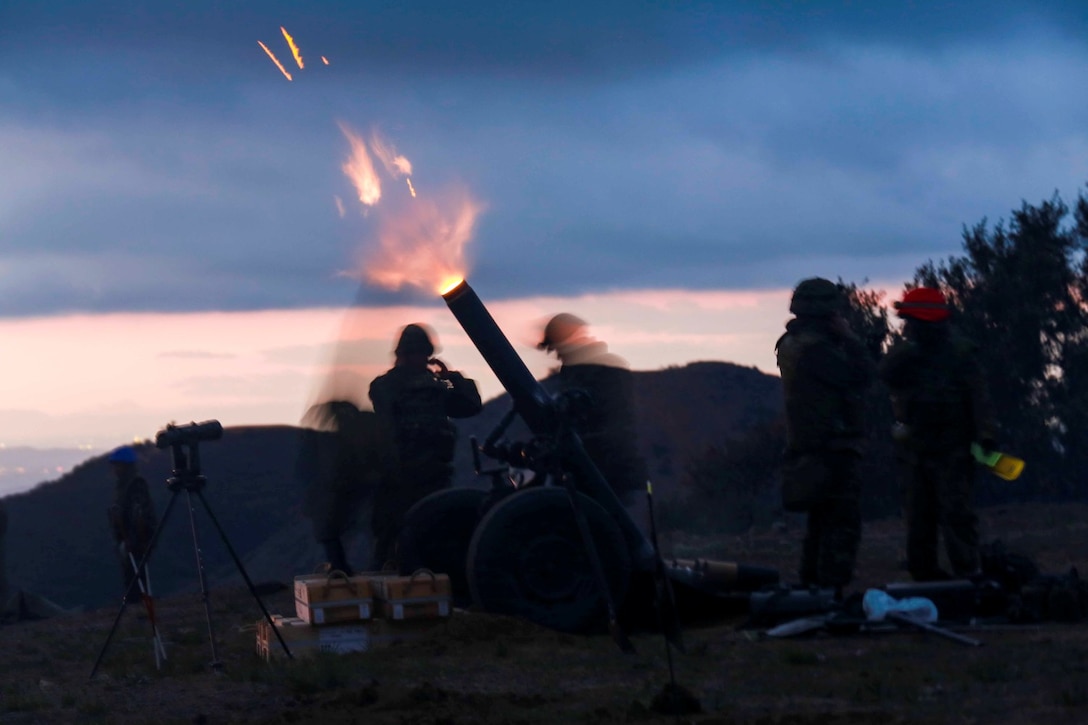 Soldiers from the Japan Ground Self-Defense Force fire a 120 mm mortar system during Exercise Iron Fist 2014 aboard Camp Pendleton, Calif., Feb. 3, 2014.  Iron Fist 2014 is an amphibious exercise that brings together Marines and sailors from the 15th Marine Expeditionary Unit, other I Marine Expeditionary Force units, and soldiers from the JGSDF, to promote military interoperability and hone individual and small-unit skills through challenging, complex and realistic training. (U.S. Marine Corps photo by Sgt. Jamean R. Berry/Released)
