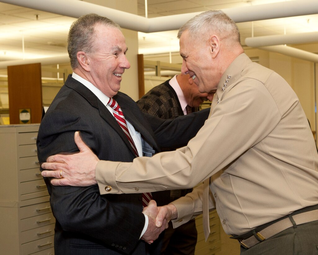 The Assistant Commandant of the Marine Corps, Gen. John M. Paxton, Jr., right, greets personnel aboard Marine Corps Base Quantico, VA, Feb. 4, 2014. (U.S. Marine Corps photo by Cpl. Tia Dufour/Released)