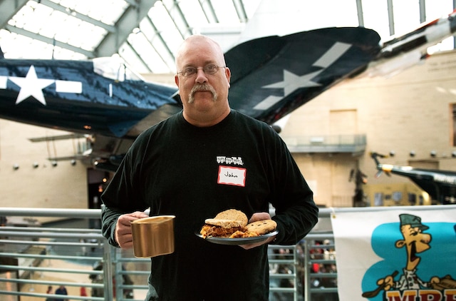 John Crist who served as a Marine, was stationed at Marine Barracks Washington D.C. and Marine Corps Base Camp Lejeune, displays the golden canteen he received for his barbeque and potato sandwich during the National Museum of the Marine Corps Second Annual MRE Cook-off in Triangle, Va., February 1. This was the second year Crist participated in the cook-off contest and is from Hagerstown, Md. 
