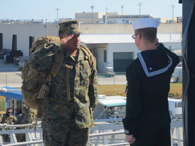 Cpl Whitehead with 6TH Marine Regiment, 2ND Marine Divsion requesting permission to board the USS New York.