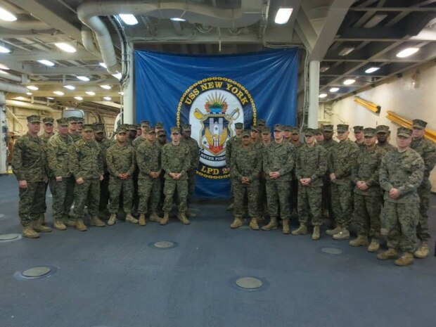 Marines from 6TH Marine Regiment, 2ND Marine division posing for the camera aboard the USS New York.