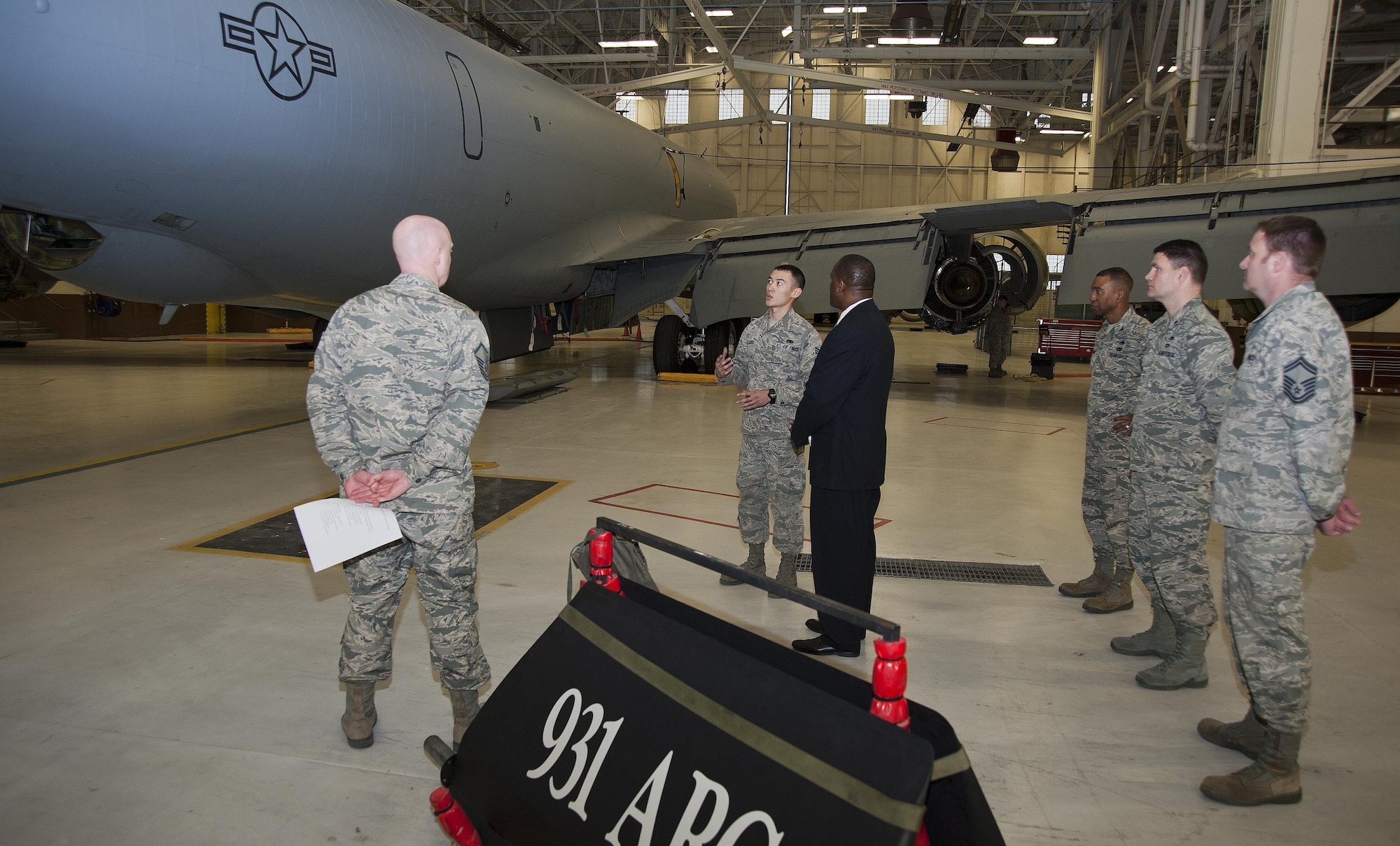 Senior Airman Danavan De Coito speaks with Dr. Jarris Taylor, deputy assistant secretary of the Air Force for the strategic diversity integration, Jan. 15, 2014, at McConnell Air Force Base, Kan. Taylor toured the base to develop a better understanding of air refueling operations. Cairo is a 22nd Maintenance Squadron crew chief (U.S. Air Force photo/Airman 1st Class Colby L. Hardin)  