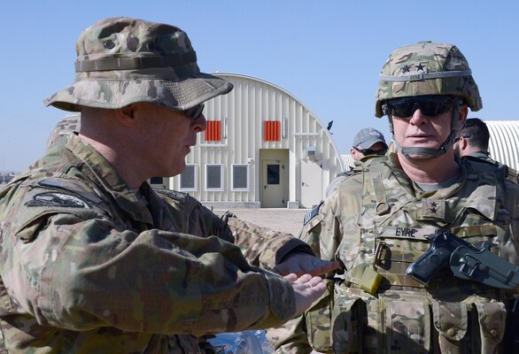 U.S. Army Corps of Engineers, Transatlantic Division Commander Maj. Gen. Michael Eyre, right, talks with Regional Command-Southwest  Afghan National Security Force Infrastrucutre Development Officer in Charge U.S. Navy Lt. Commander Brian Longbottom at a newly-built  installation which according to Maj. Gen. Michael Eyre is some of the best construction he’s seen in Afghanistan. The Afghan National Army's 215th Combat Logistics Brigade will soon call these Camp Shorabak facilities home. (U.S. Army Corps of Engineers photo by Bill Dowell/released)