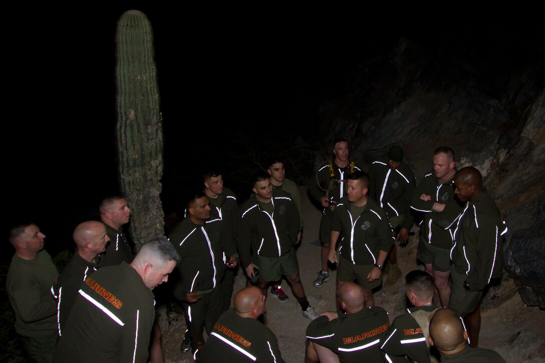 U.S. Marine Corps Brig. Gen. James W. Bierman Jr., commanding general of Marine Corps Recruit Depot San Diego and the Western Recruiting Region, speaks to the Marines of Marine Corps Recruiting Station Phoenix, atop the more than 2,600-foot summit of Piestewa Peak in Phoenix, Feb. 4, 2014. This concluded a two-day visit by Bierman, in which he visited with R.S. Phoenix command staff and multiple of the recruiting station’s sub-stations. “What an amazing capstone to this visit,” Bierman said regarding the hike. “This was certainly a recruiting station where as soon as you walked through the door you got a sense of a very close knit, focused, and proud group of Marines doing the job the right way.” (U.S. Marine Corps photo by Sgt. Tyler J. Bolken / Released)