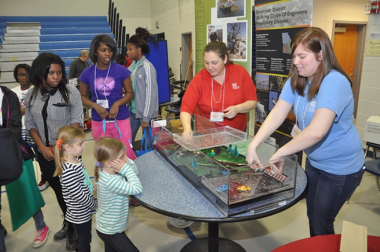 Regulatory Specialists Sherelle Reinhardt (left) and Sarah Wise of the U.S. Army Corps of Engineers Savannah District present an interactive floodplain model at the 3rd Annual Girls Engineer It Day, Feb. 1 at Woodville Tompkins High School. The event reached 350 elementary and middle school-age females and their parents to promote education in STEM (science, technology, engineering and math). USACE photo by Tracy Robillard.