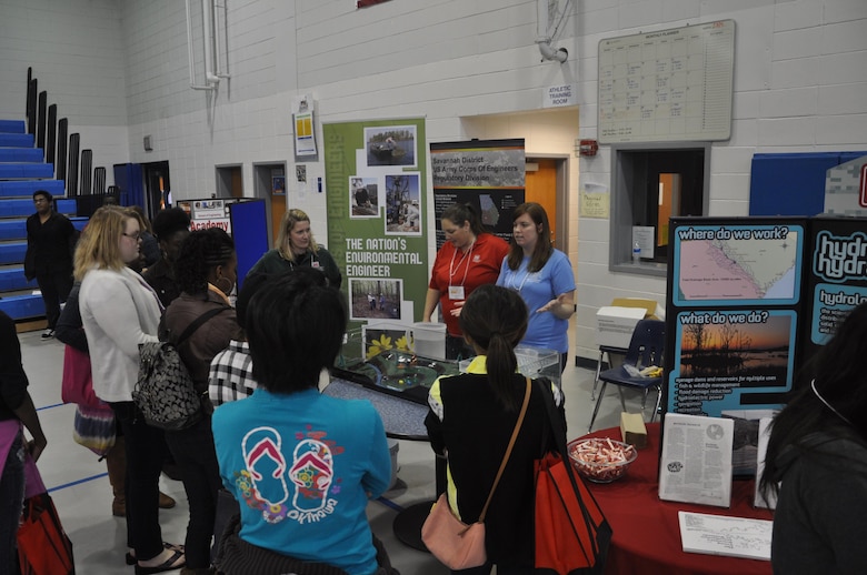 SAVANNAH, Ga. – Members of the U.S. Army Corps of Engineers Savannah District: Beth Williams, dam and levee safety program manager (left); and Regulatory Specialists Sherelle Reinhardt (center) and Sarah Wise (right) talk with students about careers with the Corps at the 3rd Annual Girls Engineer It Day, Feb. 1. The event reached 350 elementary and middle school-age females and their parents to promote education in STEM (science, technology, engineering and math). USACE photo by Tracy Robillard.