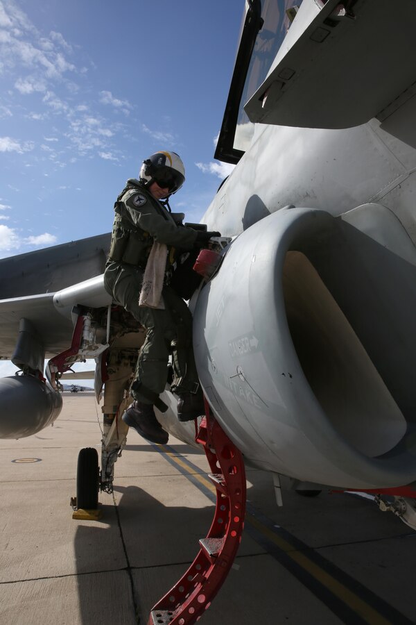 Navy Lt. Ana Brown, an EA-6B Prowler pilot with Electronic Attack Squadron 131 from Naval Air Station Whidbey Island, Wash., disembarks from the aircraft after flying it to Marine Corps Air Station Miramar, Calif., Feb. 4. Brown is one of four pilots to fly the aircraft to the air station where it is scheduled to  be demilitarized and put on display at the Flying Leatherneck Aviation Museum.
