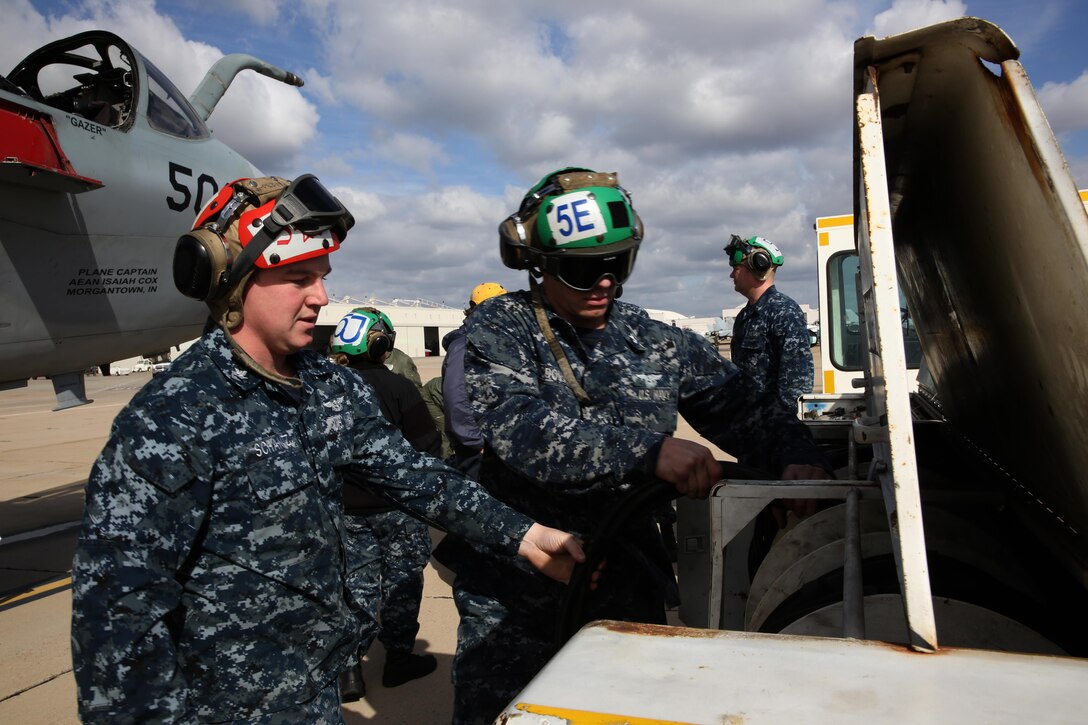 Petty officers with Electronic Attack Squadron 131 from Naval Air Station Whidbey Island, Wash., prepare to ground an EA-6B Prowler before defueling the aircraft aboard Marine Corps Air Station Miramar, Calif., Feb. 4. After all ordnance is stripped from the aircraft, and explosives are taken from the ejection seats, the aircraft is scheduled to be taken to the Flying Leatherneck Aviation Museum for display. 