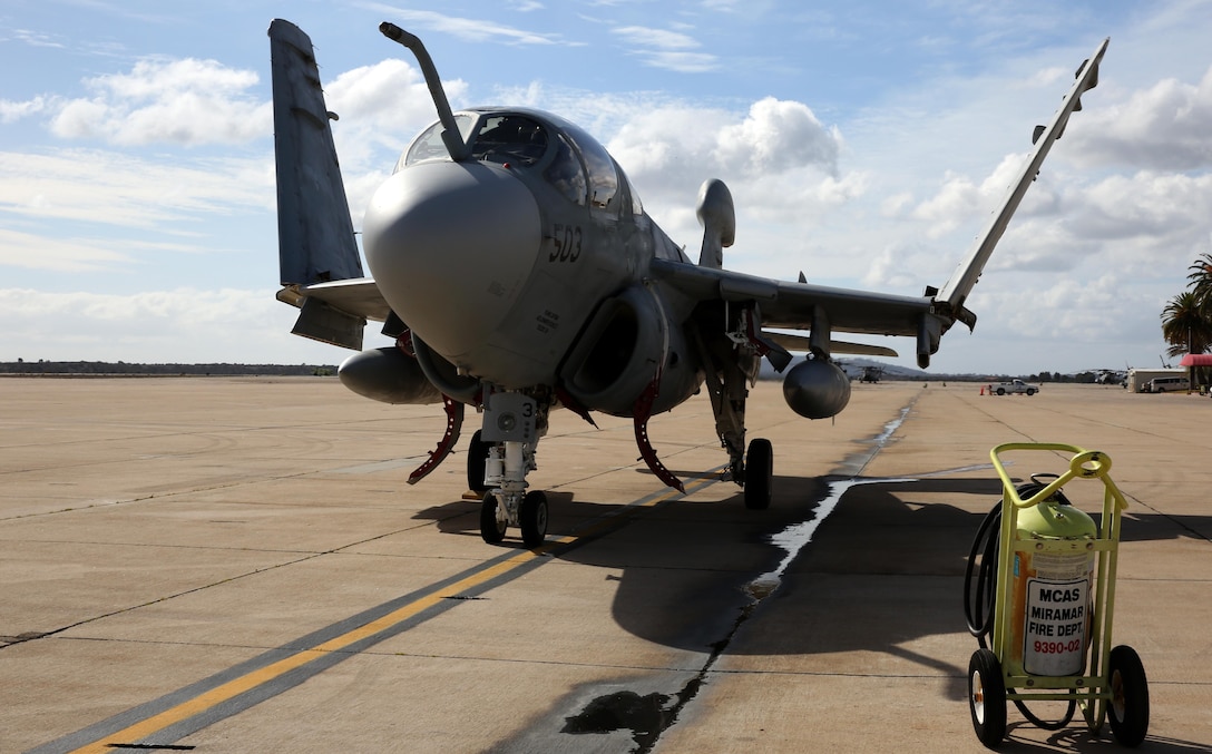 Pilots in the cockpit of an EA-6B Prowler fold the aircraft’s wings after flying from Naval Air Station Whidbey Island, Wash. to Marine Corps Air Station Miramar, Calif. Feb. 4. The Prowler is the newest aircraft slated to be displayed at the Flying Leatherneck Aviation Museum as the Navy and Marine Corps transition to the EA-18G Growler.