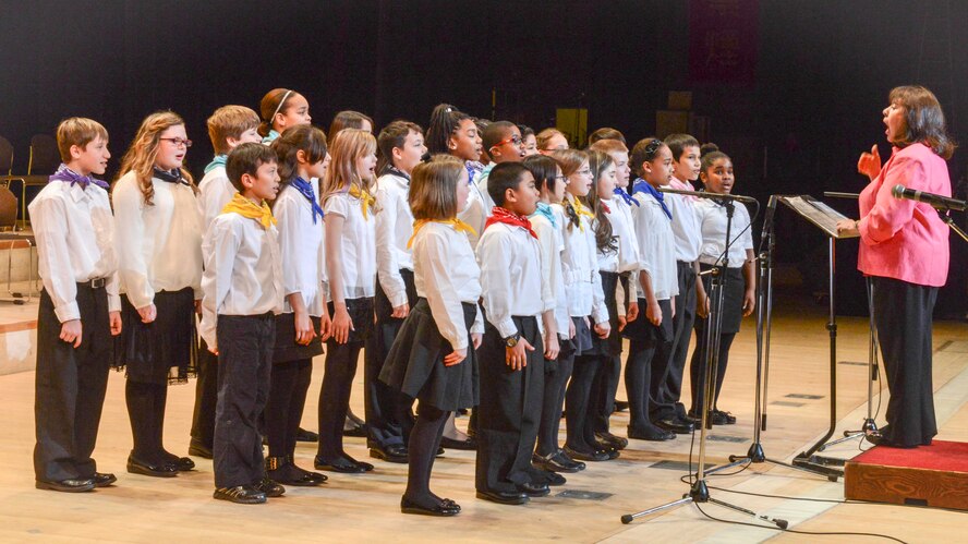 Students from Joan K. Mendel elementary school perform on a stage during a Japan - U.S. Joint Concert at Tachikawa City, Japan, Feb. 2, 2014.  A total of seven different groups participated in the concert.  (U.S. Air Force photo by Airman 1st Class Soo C. Kim / released)