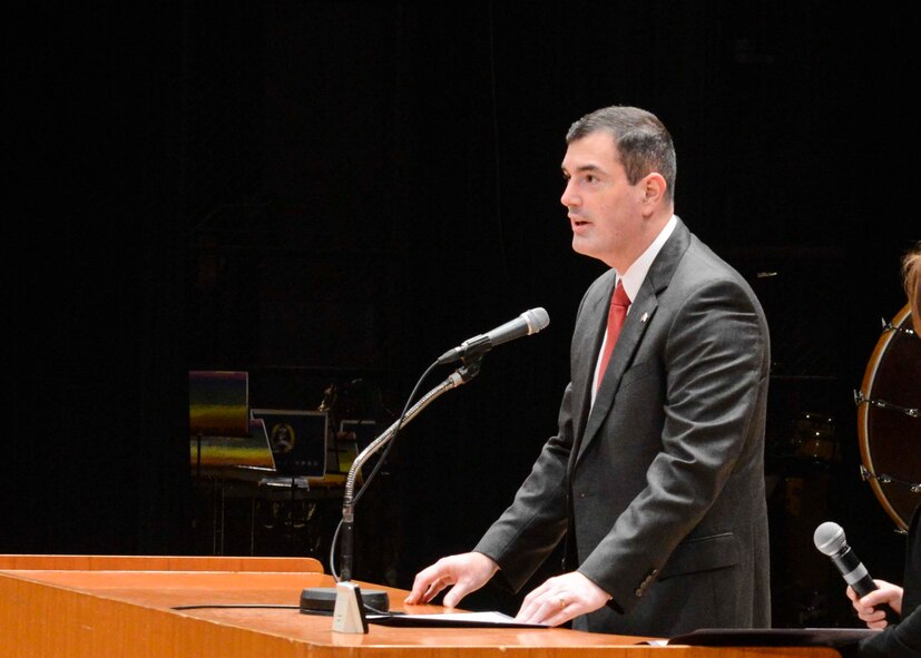 Col. Mark August, 374th Airlift Wing commander, gives out a speech at the Japan - U.S. Joint Concert, Tachikawa City, Japan, Feb. 2, 2014.  August mentioned the importance of providing children with unique opportunity to interact and connect through music while fostering good relationship.  (U.S. Air Force photo by Airman 1st Class Soo C. Kim / released)
