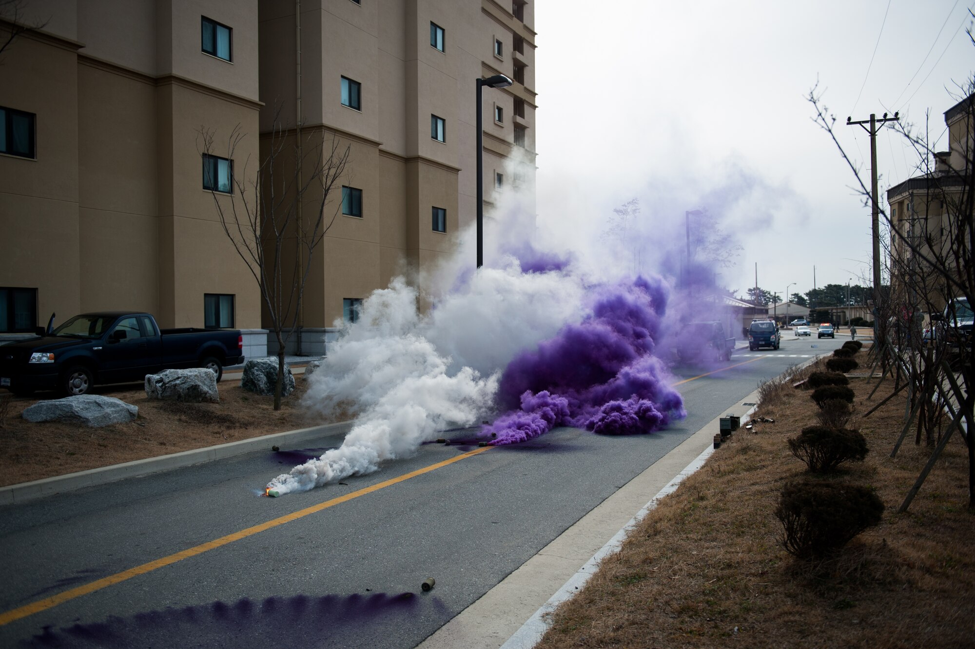 Smoke grenades are used to add realism during exercise Beverly Midnight 14-01 at Kunsan Air Base, Republic of Korea, Feb. 5, 2014. Smoke grenades are commonly used during exercises to simulate explosions and enemy fire. (U.S. Air Force photo by Staff Sgt. Clayton Lenhardt/Released)