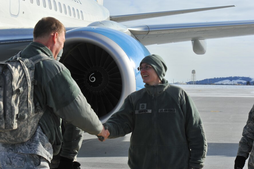 Chief Master Sgt. Wendy Hansen, 92nd Air Refueling Wing command chief, greets a member of Air Mobility Command’s Inspector General team as they arrive for the Unit Effectiveness Inspection Feb. 5, 2014 at Fairchild Air Force Base, Wash. The Fairchild UEI will continue through Feb. 14. Inspectors from the AMC IG office will be inspecting compliance, continuous improvement and self-assessment programs. (U.S. Air Force photo/Staff Sgt. Veronica Montes)