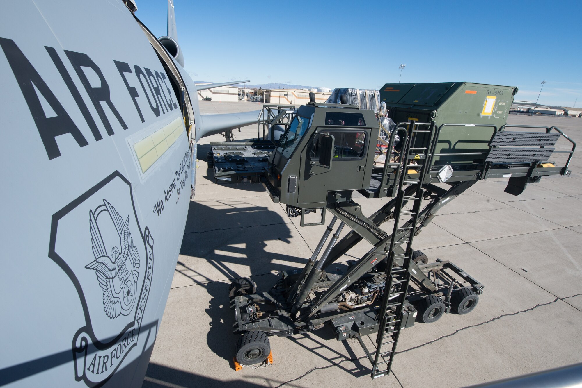 A KC-10 Extender aircraft from Travis Air Force Base, Calif., receives cargo from 366th Logistics Readiness Squadron air transport loaders Jan. 31, 2014 at Mountain Home Air Force Base, Idaho. The cargo will support both Combat Archer and Combat Hammer exercises. (U.S. Air Force photo by Tech. Sgt. JT May III/Released)