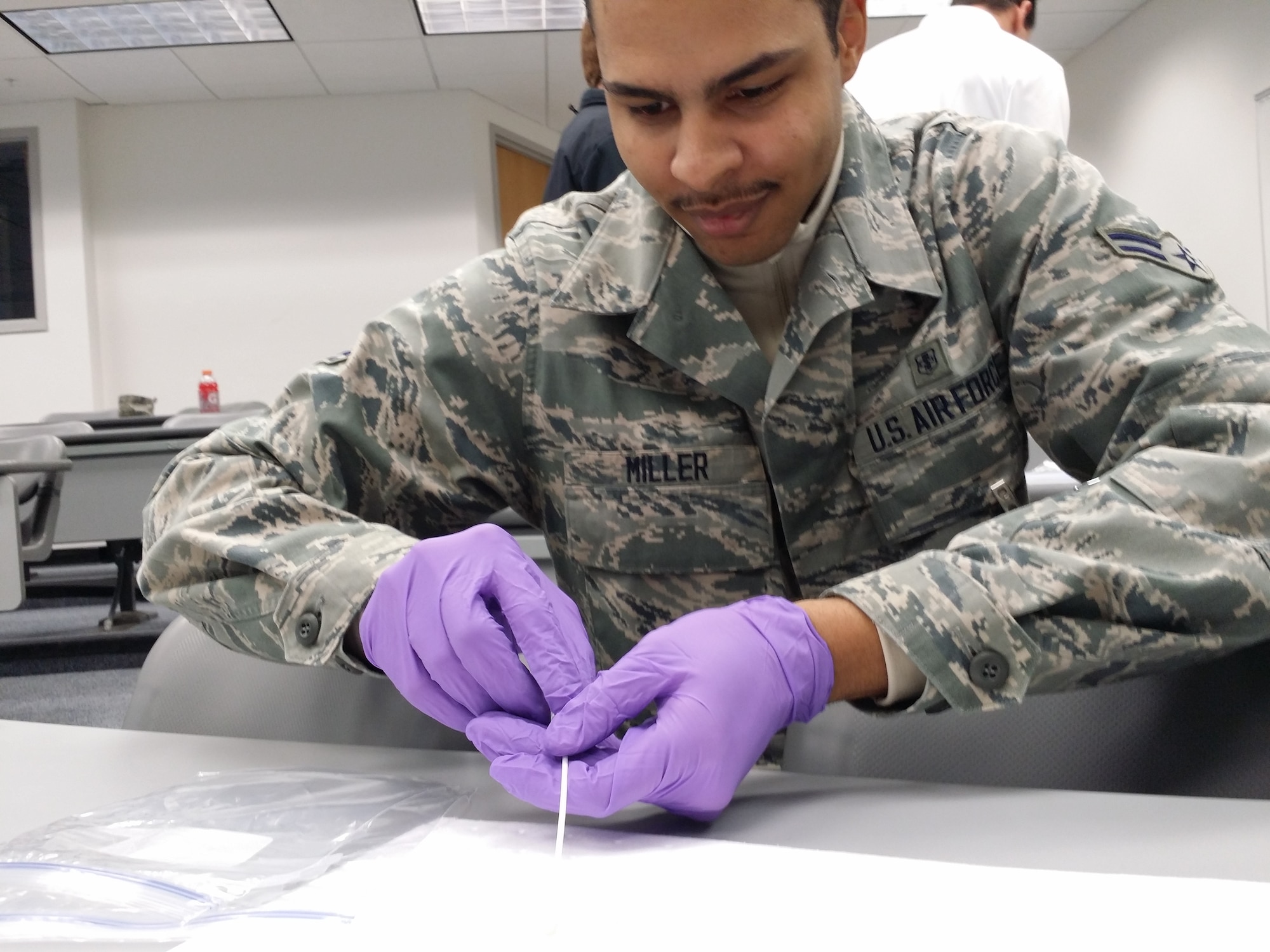 Airman 1st Class Jaren Miller conducts an experiment during a training session with the FBI at the Academy Jan. 16. (U.S. Air Force/Courtesy Photo)