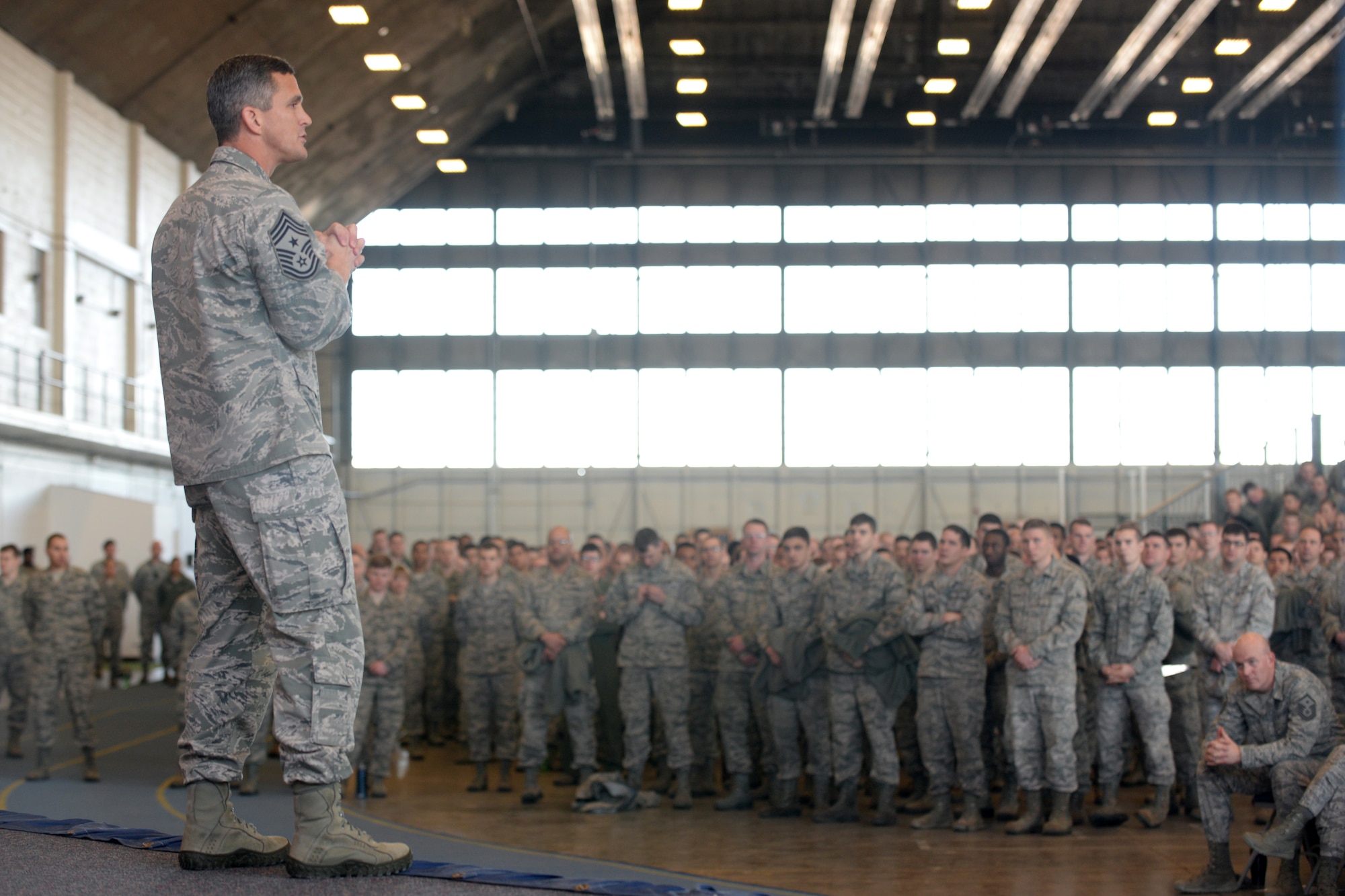Chief Master Sgt. Richard Parsons, Air Combat Command command chief, speaks to Ellsworth Airmen during an enlisted all call in the Pride Hangar at Ellsworth Air Force Base, S.D. Jan. 29, 2014. Airmen in attendance were offered the opportunity to ask questions related to Air Force current events, retirement benefits and promotion procedures, among other topics. (U.S. Air Force photo by Airman 1st Class, Rebecca Imwalle/Released)