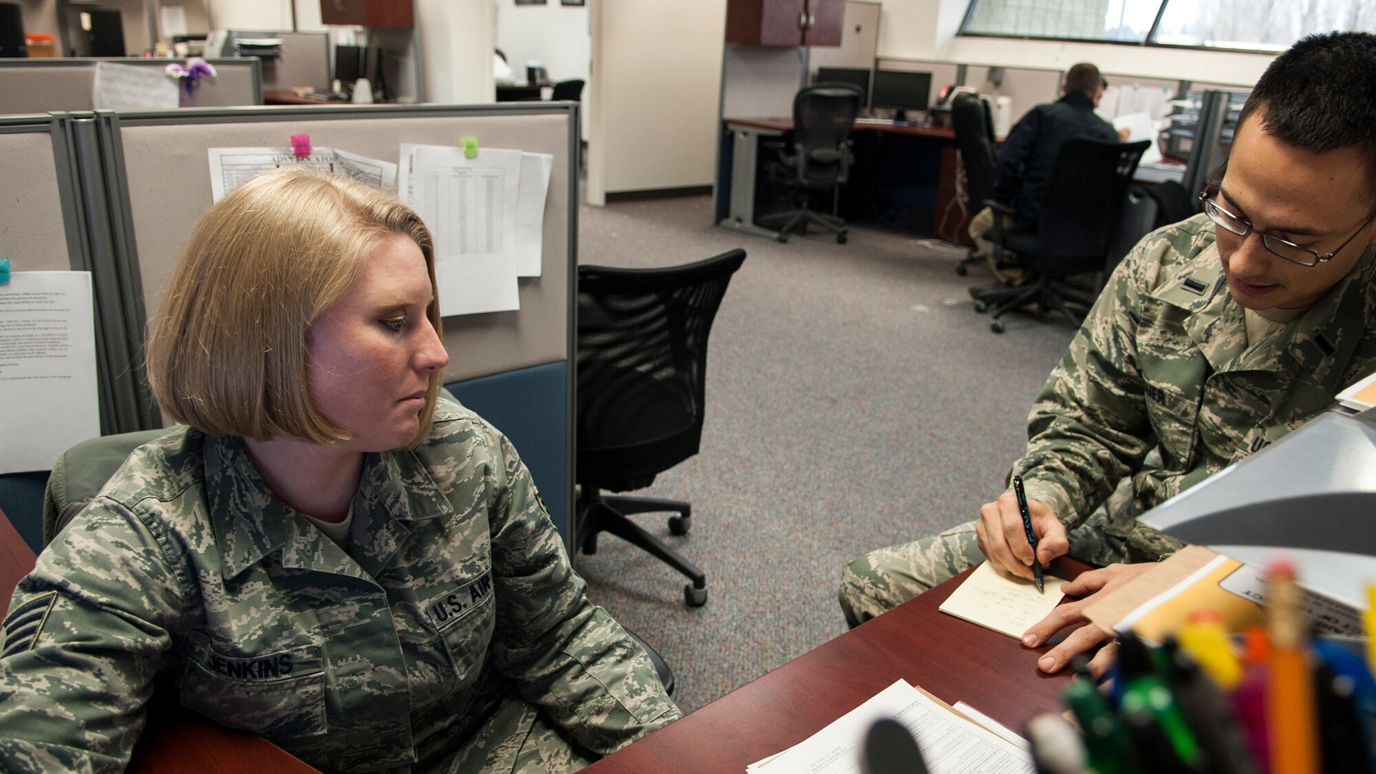 Staff Sgt. Anastacia Jenkins, 366th Comptroller Squadron financial management NCO-in-charge, assists 1st Lt. Ryan Fisher, 366th Fighter Wing Judge Advocate, with questions related to official travel at Mountain Home Air Force Base, Idaho, Feb. 5, 2014. When it comes to customer service, the 366th CPTS doesn’t differentiate between ranks or status, said Jenkins, stating, “There are no VIPs here; every customer is important … We treat every customer equally and strive to make sure all their needs are met.” (U.S. Air Force photo by Master Sgt. Kevin Wallace/RELEASED)