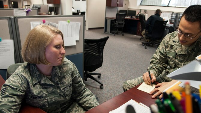 Staff Sgt. Anastacia Jenkins, 366th Comptroller Squadron financial management NCO-in-charge, assists 1st Lt. Ryan Fisher, 366th Fighter Wing Judge Advocate, with questions related to official travel at Mountain Home Air Force Base, Idaho, Feb. 5, 2014. When it comes to customer service, the 366th CPTS doesn’t differentiate between ranks or status, said Jenkins, stating, “There are no VIPs here; every customer is important … We treat every customer equally and strive to make sure all their needs are met.” (U.S. Air Force photo by Master Sgt. Kevin Wallace/RELEASED)