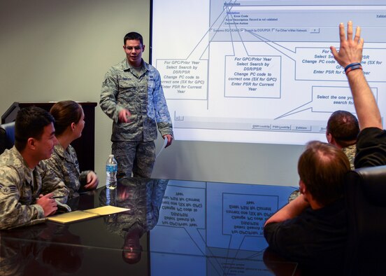 Senior Airman William Tibbetts, 366th Comptroller Squadron financial analyst, briefs new budget procedures to fellow Comptrollers at Mountain Home Air Force Base, Idaho, Jan. 23, 2014. The 366th CPTS team takes technical proficiency very seriously, holds frequent training internal training sessions and trains all 366th Fighter Wing resource advisors weekly. (U.S. Air Force photo by Master Sgt. Kevin Wallace/RELEASED)