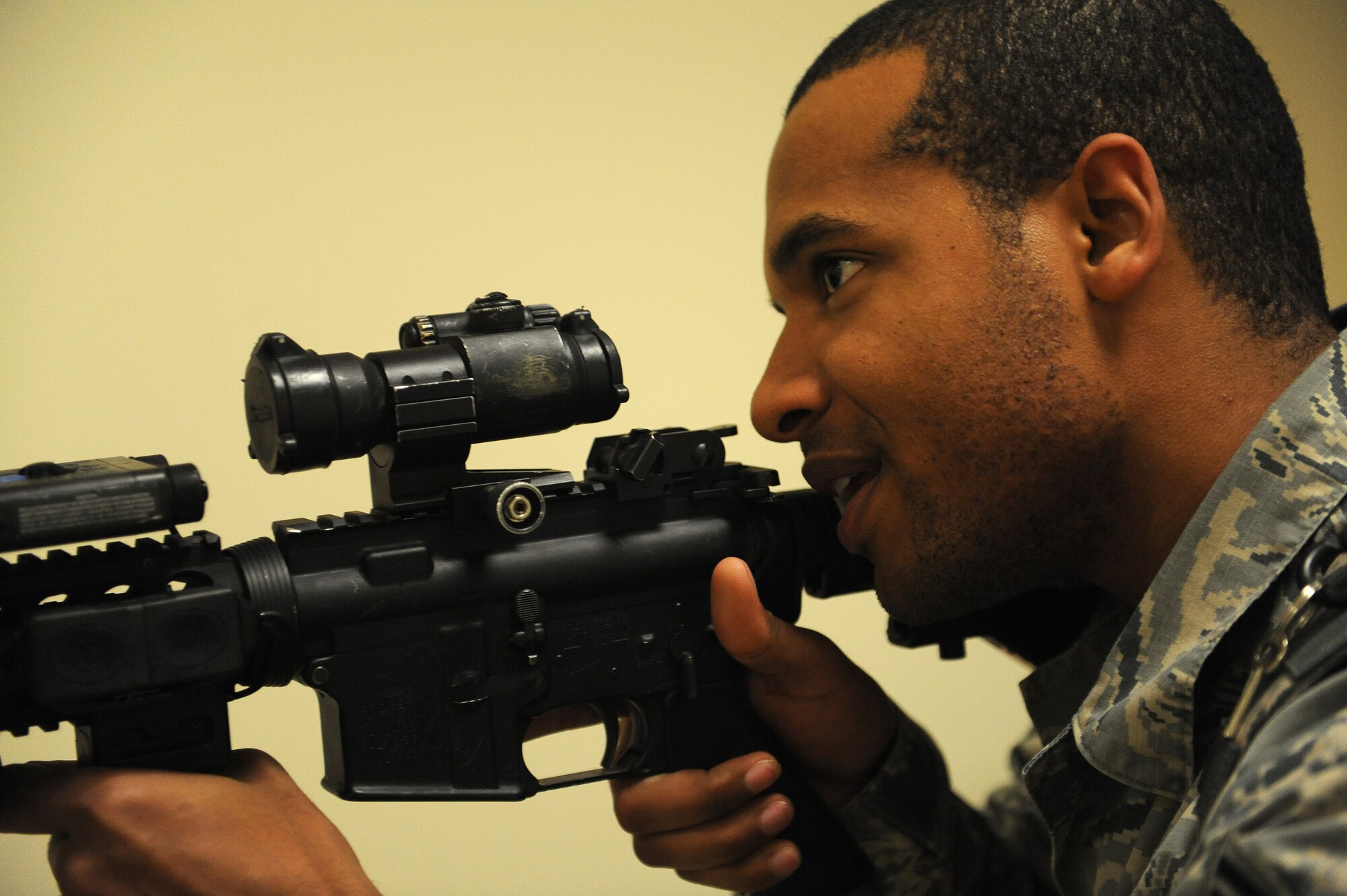 Staff Sgt. Kenneth Francois walks down the hallway during a active shooter training Jan. 29, 2014 at Scott Air Force Base, Ill.  The scenario included a single shooter, and the Airmen had to seek this person out and disarm him. Francois is a 375th Security Forces defender. (U.S. Air Force photo/Staff Sgt. Maria Bowman)