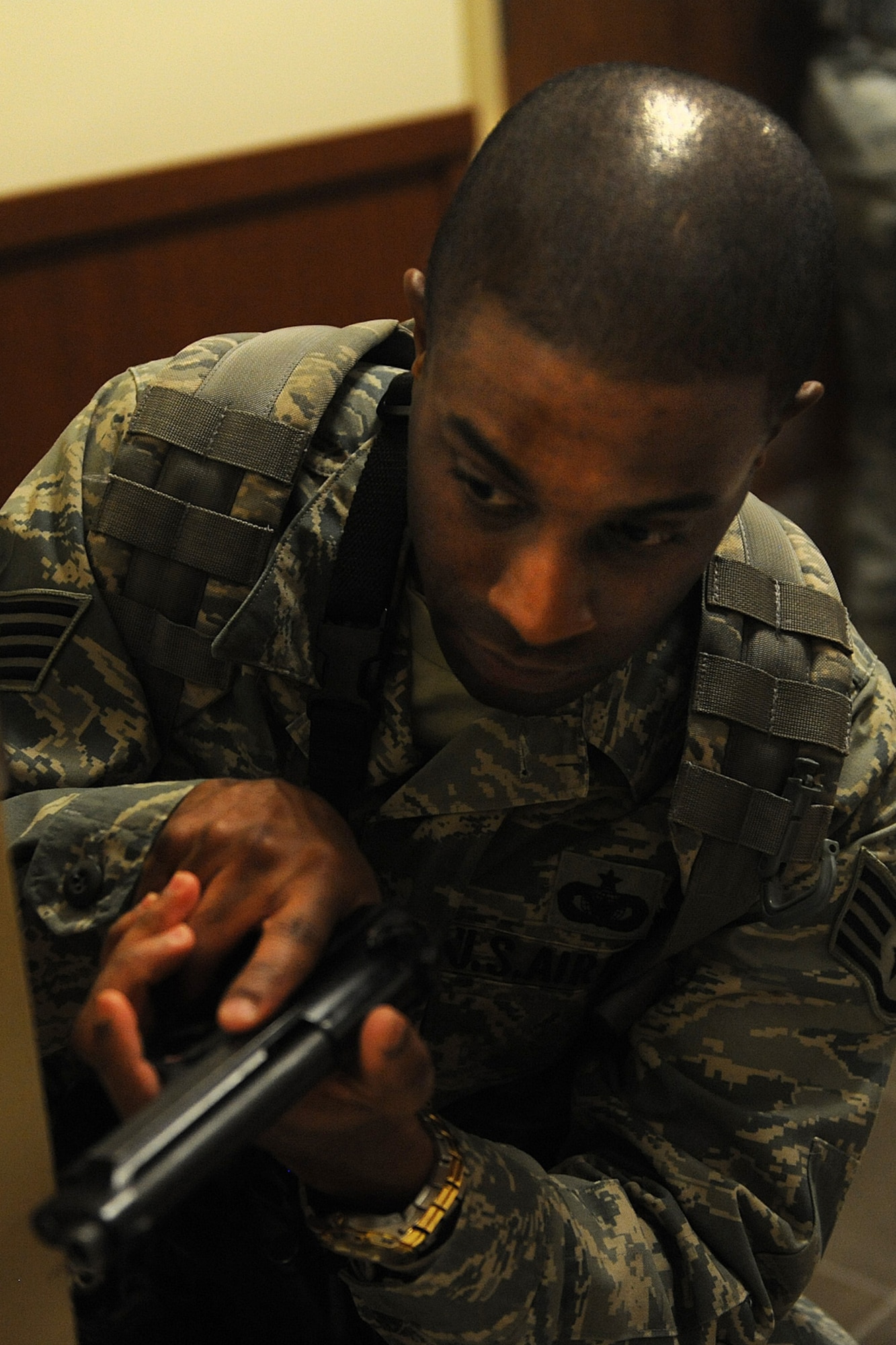 Staff Sgt. Aaron Davis participates in active shooter training Jan. 29, 2014 at Scott Air Force Base, Ill.  The Airmen went through the hallways searching for the person who was acting out the role of an active shooter.  Once the person was found, they disarmed and apprehended him.  Davis is a 375th Security Forces Squadron defender. (U.S. Air Force photo/Staff Sgt. Maria Bowman)