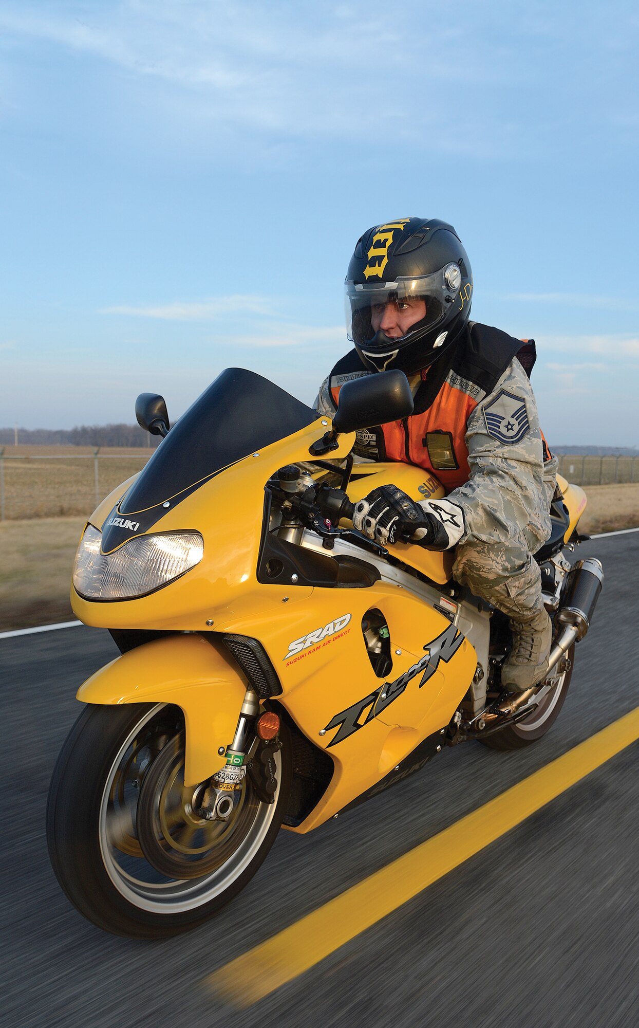 MSgt John Willard Jr. rides his yellow and black 2001 Suzuki TL1000R 1000cc motorcycle at Dover AFB, Del.