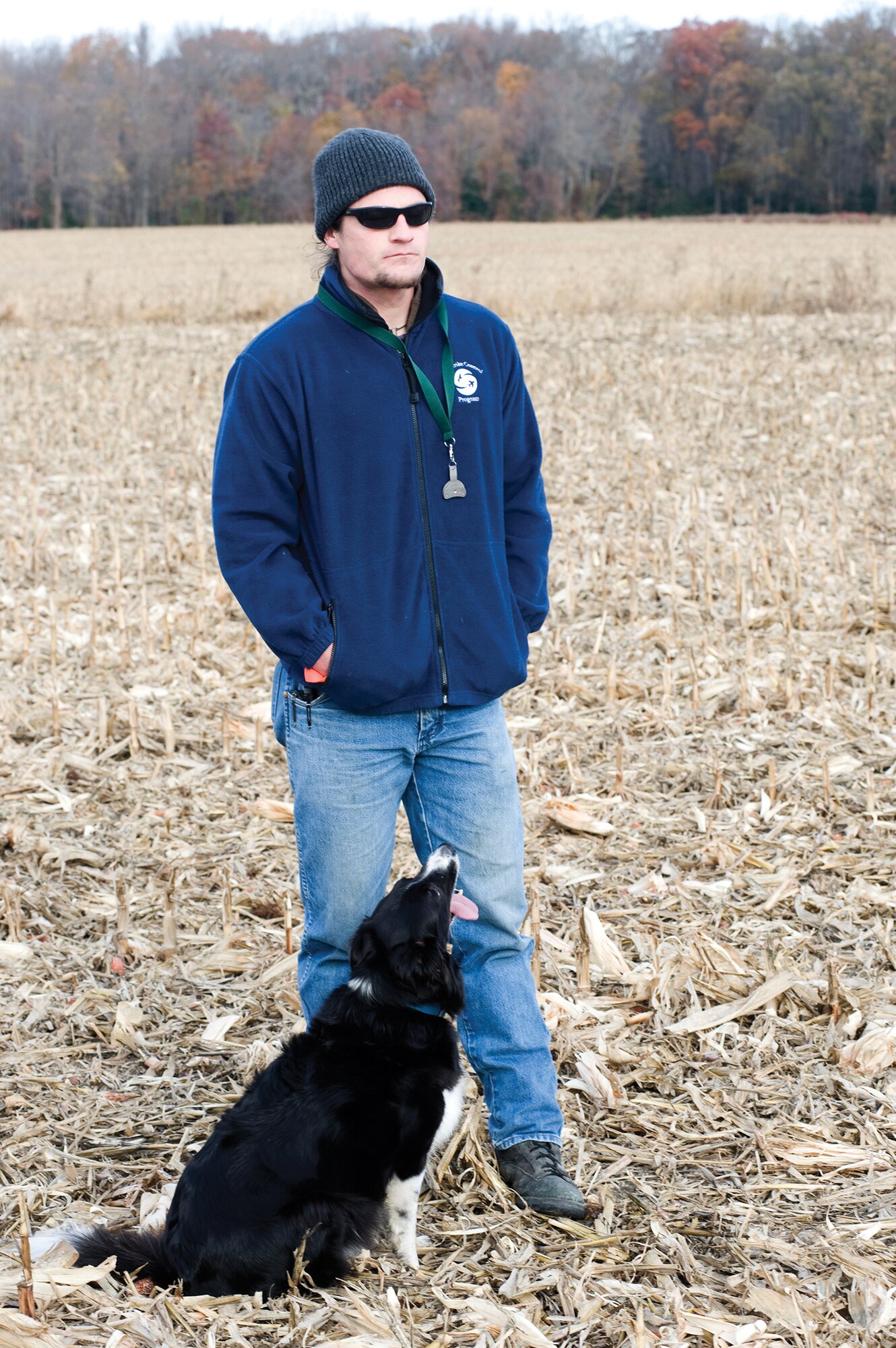 David Curtiss, 436th AW Safety Office wildlife
manager, and “Kilo” watch the flight pattern of
geese, ensuring they are moving away from the base.
Curtiss and Kilo battle each day to keep birds out of
the flight path of Team Dover.