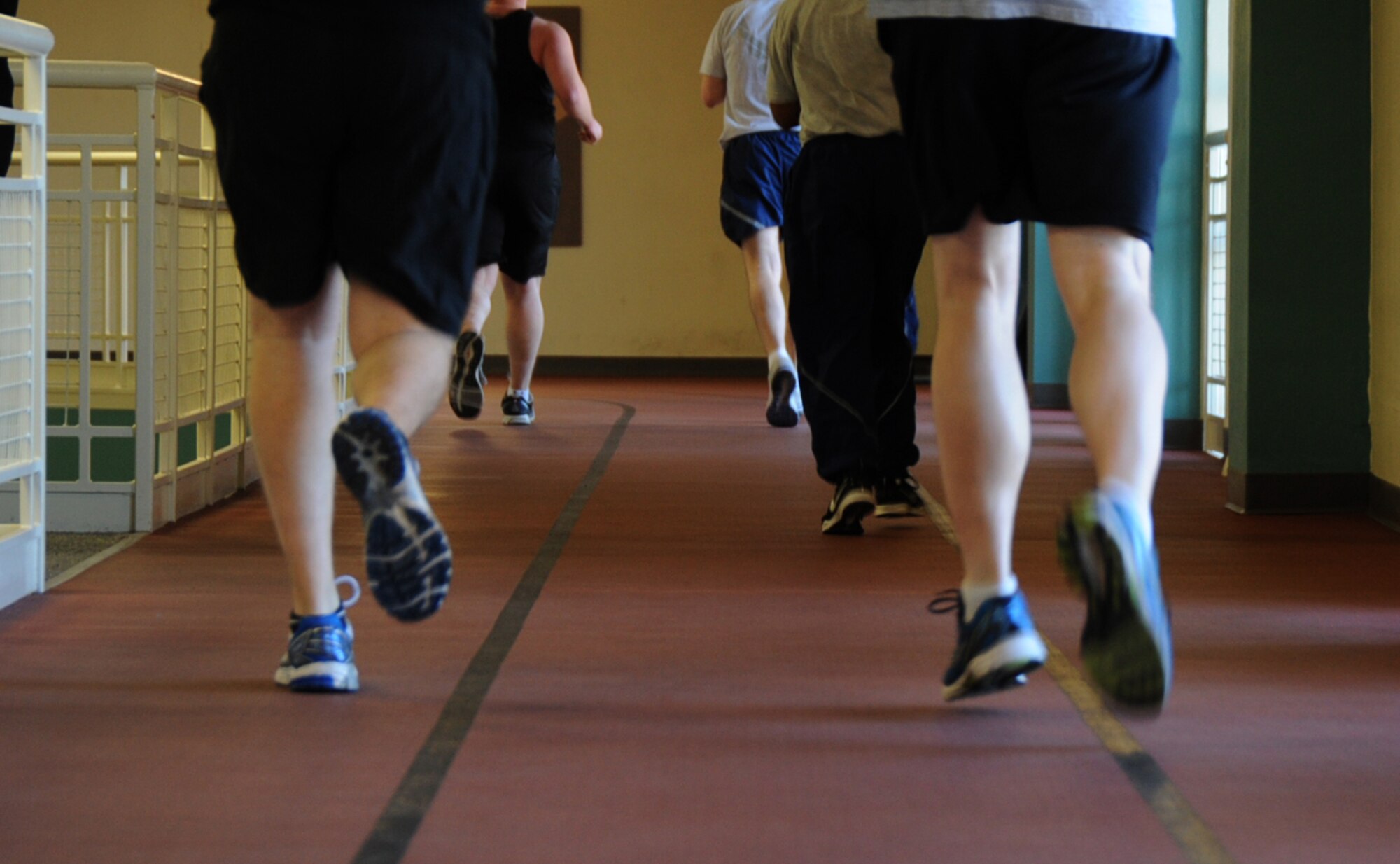 Members of Team Scott run during physical training Jan. 28, 2014 at Scott Air Force Base, Ill. Air Force members are tested on a 1.5 mile run, push-ups, sit-ups and abdominal circumference. (U.S. Air Force photo/Airman 1st Class Sarah Hall-Kirchner)