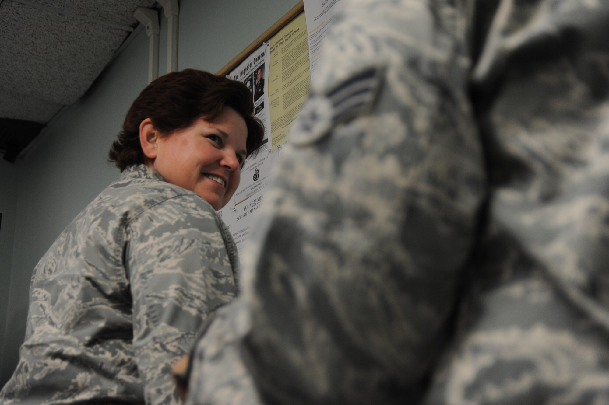Lt. Col. Lorri Reed weighs-in at the beginning of the Biggest Loser 5 Challenge at Scott Air Force Base, Ill. on Jan. 27, 2014. The challenge, in its fifth year, hopes to encourage Team Scott to have healthy lifestyles. (U.S. Air Force photo/Airman 1st Class Sarah Hall-Kirchner)