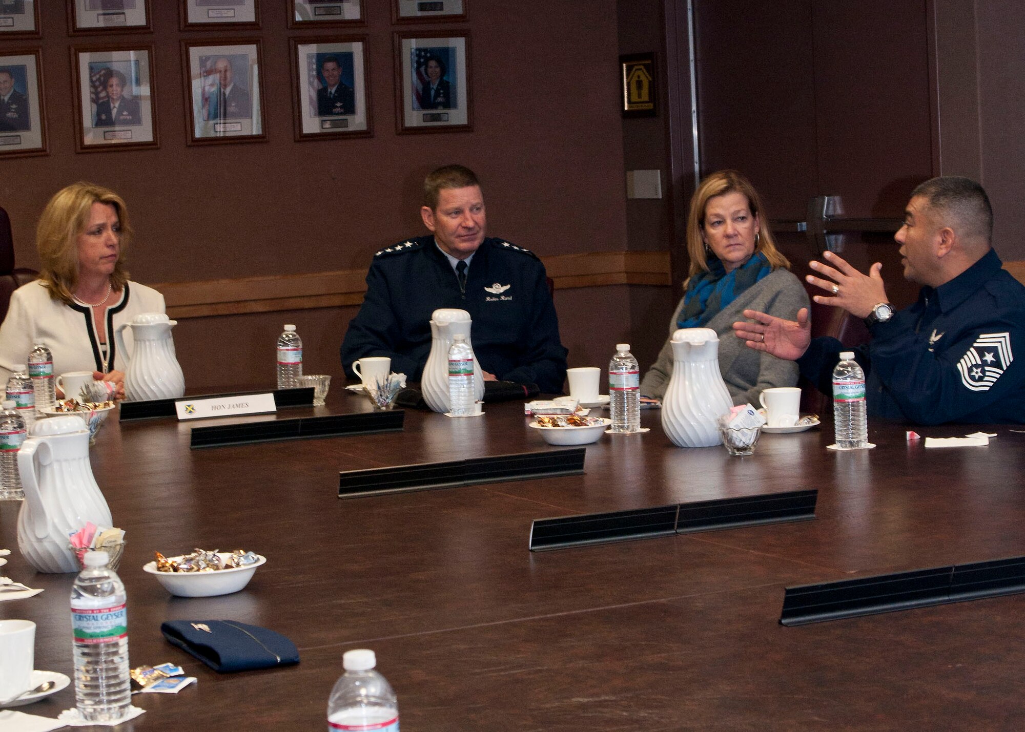 Chief Master Sgt. Gerardo Tapia, command chief, Air Education and Training Command, explains some of the issues Airmen have brought to his attention about force shaping programs to Secretary of the Air Force Deborah Lee James and AETC commander Gen. Robin Rand and his wife, Kate, during a mission brief Jan. 31 at Joint Base San Antonio-Lackland, Texas. (U.S. Air Force photo by Staff Sgt. Marissa Tucker) 