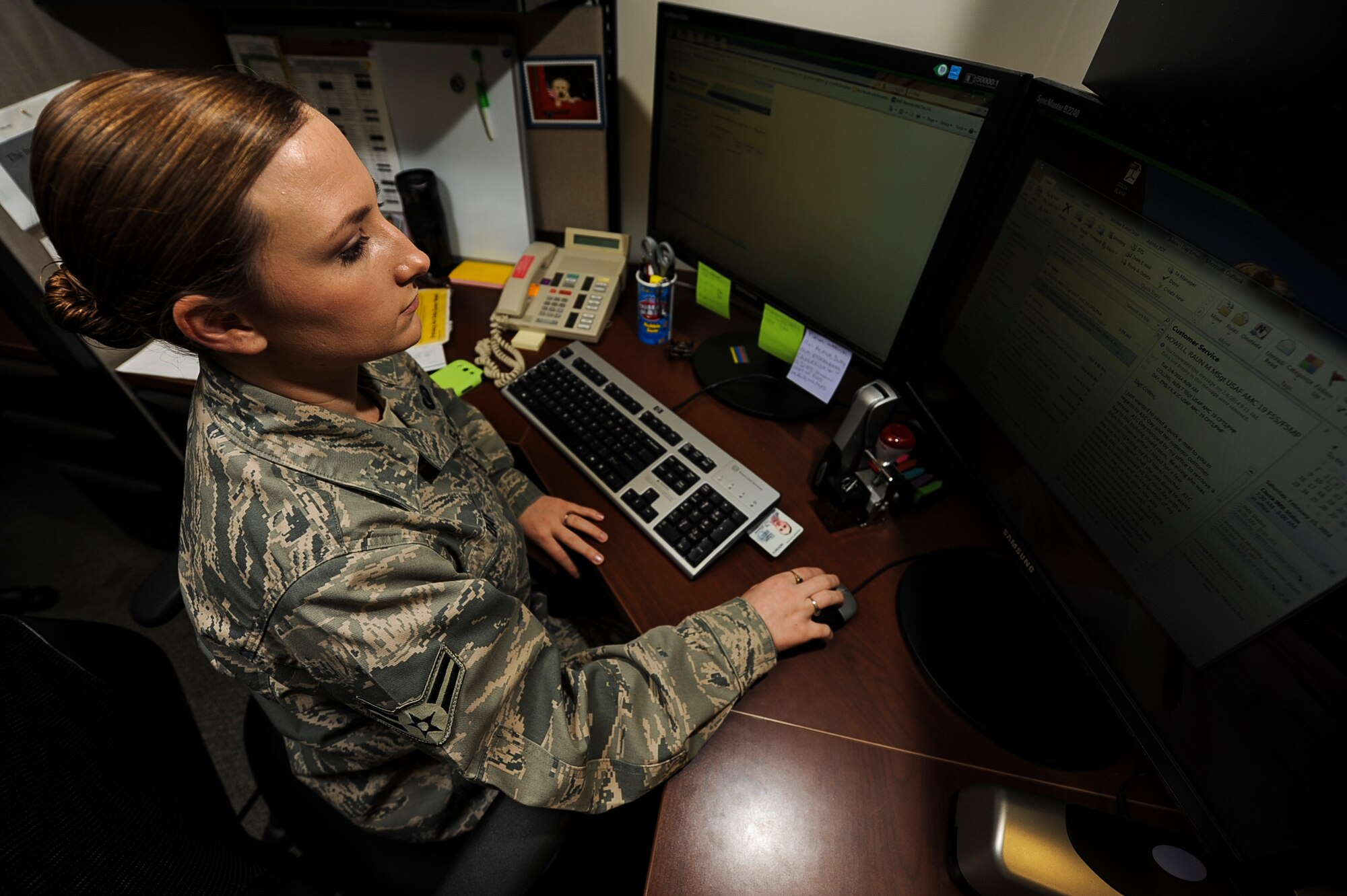 Airman 1st Class Emily Day, a 19th Comptroller Squadron civilian pay technician, processes members’ eminent danger pay benefits Feb. 4, 2014, at Little Rock Air Force Base, Ark. As the installation’s lead cashier, she processed 168 payment and collection vouchers valued at more than $475,000 providing accountability down to the penny. (U.S. Air Force photo by Airman 1st Class Cliffton Dolezal)