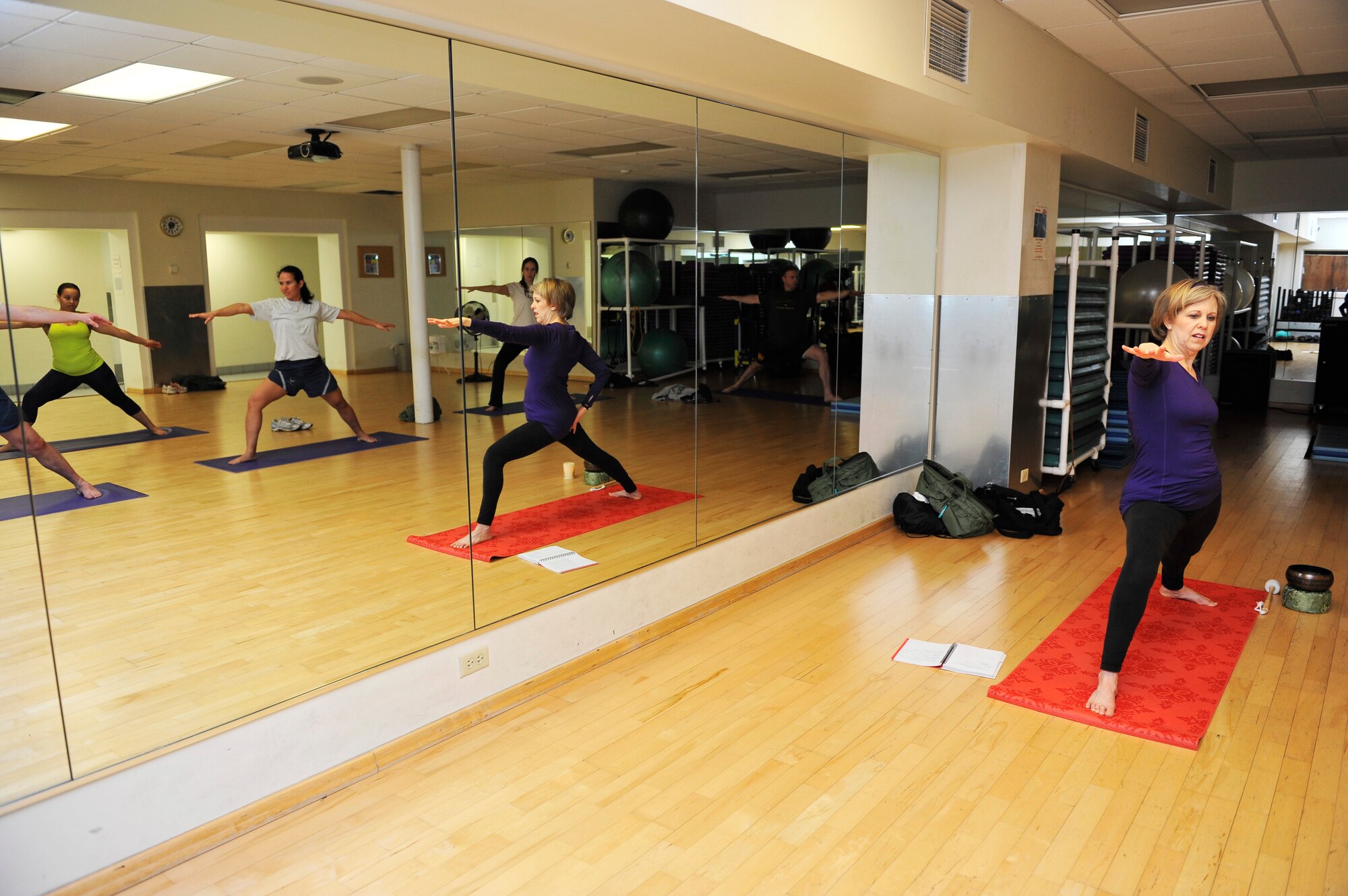 Chaplain (Lt. Col.) Christine Blice-Baum host a yoga class for Biomedical Science Corps week Jan. 29, 2014, at Scott Air Force Base, Ill. The yoga class was one of many events held during the week of Jan 27-31. Blice-Baum is the 375th Air Mobility Wing chaplain. (U.S. Air Force photo/Airman 1st Class Kiana Brothers)