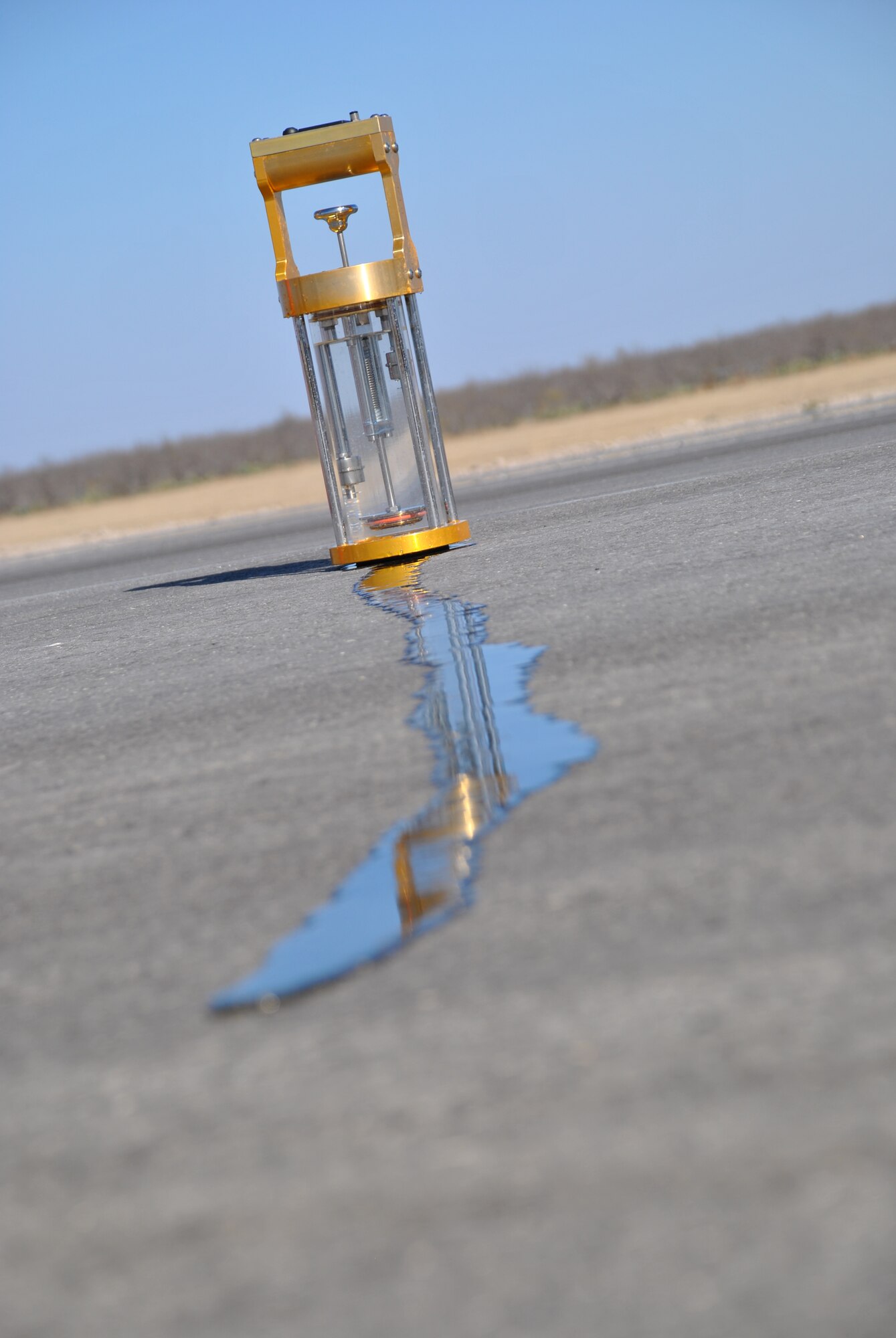 SPOFFORD, Texas -- A hydro-timer releases water to allow AFCEC Airfield Pavement Evaluation Team members to gather readings to help verify adequate drainage and surface texture on the newly refinshed airfield here. (U.S. Air Force photo/Michael Briggs) 
