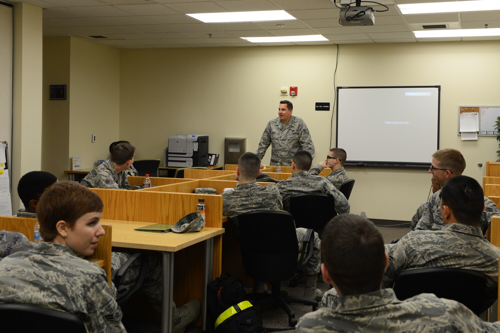 U.S. Air Force Tech. Sgt. Dennis Jones, 20th Civil Engineer Squadron engineering assistant, mentors Airmen during the First Term Airman’s Course at Shaw Air Force Base, S.C., Jan. 28, 2014. The course is meant to introduce first-term Airmen to the base and familiarize them with different organizations on base. (U.S. Air Force photo by Airman 1st Class Diana M. Cossaboom/Released)