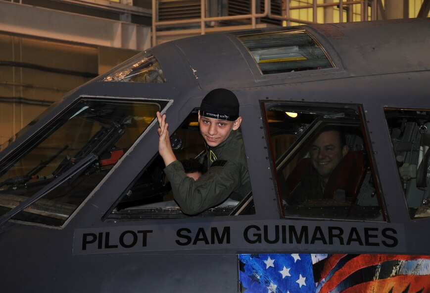 Sam Guimaraes, 17-year-old Alexandria, La. native, poses for a photo inside a B-52H Stratofortress during the Pilot for a Day program on Barksdale Air Force Base, La., as part of the Pilot for a Day program, Jan. 4, 2014. Guimaraes became an honorary member of Barksdale and had the opportunity to attend an aircrew brief, see maintenance performed on a B-52H Stratofortress, watch a military working dogs demonstration and fly in a simulator. (U.S. Air Force photo/Staff Sgt. Sean Martin)
