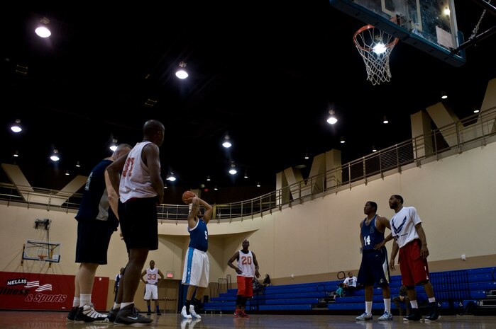 Javerrick Austin, 99th Security Forces Squadron power forward, shoots a free throw during an intramural basketball game against the 547th Intelligence Squadron at the Warrior Fitness Center Feb. 3, 2014, at Nellis Air Force Base, Nev. Nine games will be played in the regular season, and the top 10 teams from the two divisions, East and West, will make the playoffs. The 99th SFS won the game 60-49. (U.S. Air Force photo by Senior Airman Christopher Tam)