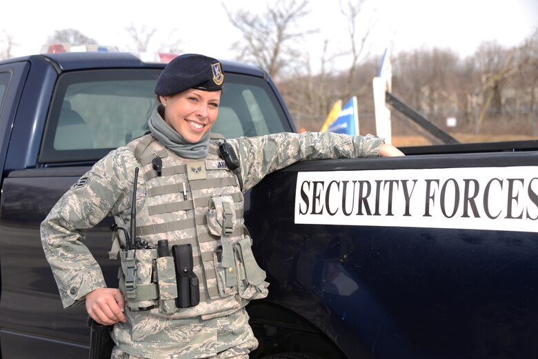 Senior Airman Miriam Y. Jarvis, 175th Security Forces Squadron, stands by a vehicle belonging to the 175th Security Forces Squadron.  Senior Airman Jarvis has been in the Maryland Air National Guard for five years as a member of the Security Forces Squadron.  (Air National Guard photo by Senior Master Sgt. Edward Bard/RELEASED)