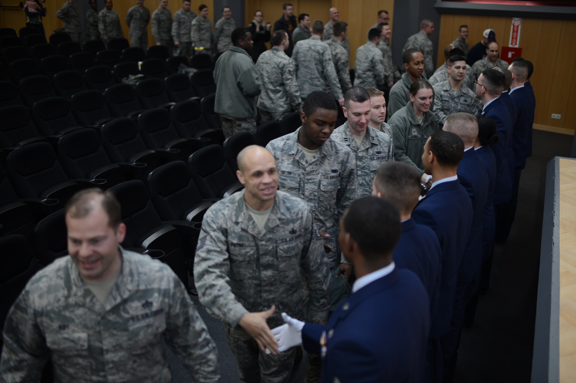 Airmen congratulate the newly inducted 52nd Fighter Wing Guard Members after a week-long training, at Spangdahlem Air Base Jan. 31, 2014. The Airmen who graduated from the training mastered the basics of ceremonial drill, advanced ceremonies and some funeral honor sequences. (U.S. Air Force photo by Senior Airman Gustavo Castillo/Released)