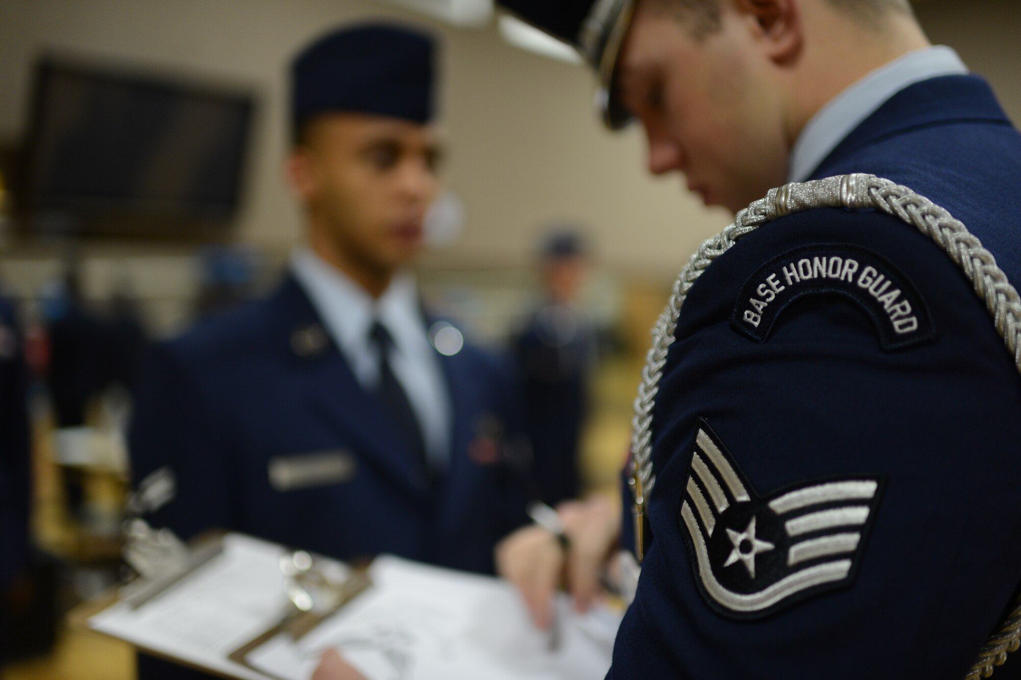 U.S. Air Force Staff Sgt. Josh McMillan, 52nd Fighter Wing Honor Guard NCO in charge of training, from San Antonio, conducts an inspection of aspiring honor guard members on Spangdahlem Air Base, Jan. 27, 2014. The aspiring honor guard members had to answer general Air Force knowledge and honor guard questions during the inspection. (U.S. Air Force photo by Senior Airman Gustavo Castillo/Released)